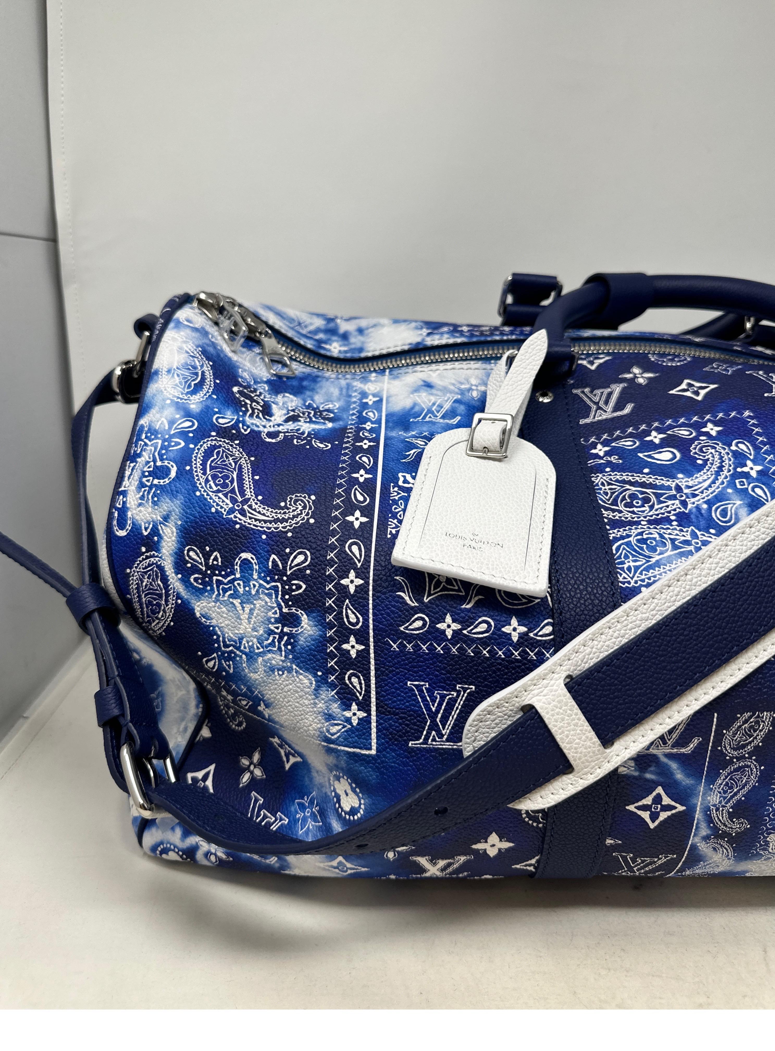 Louis Vuitton Limited Edition Bandana Keepall 50 Bag. Mint like new condition. Rare collector's bag. Never used. Limited bleached blue monogram design. Includes all the original accessories when purchased. Includes the original tags, lock, and keys.