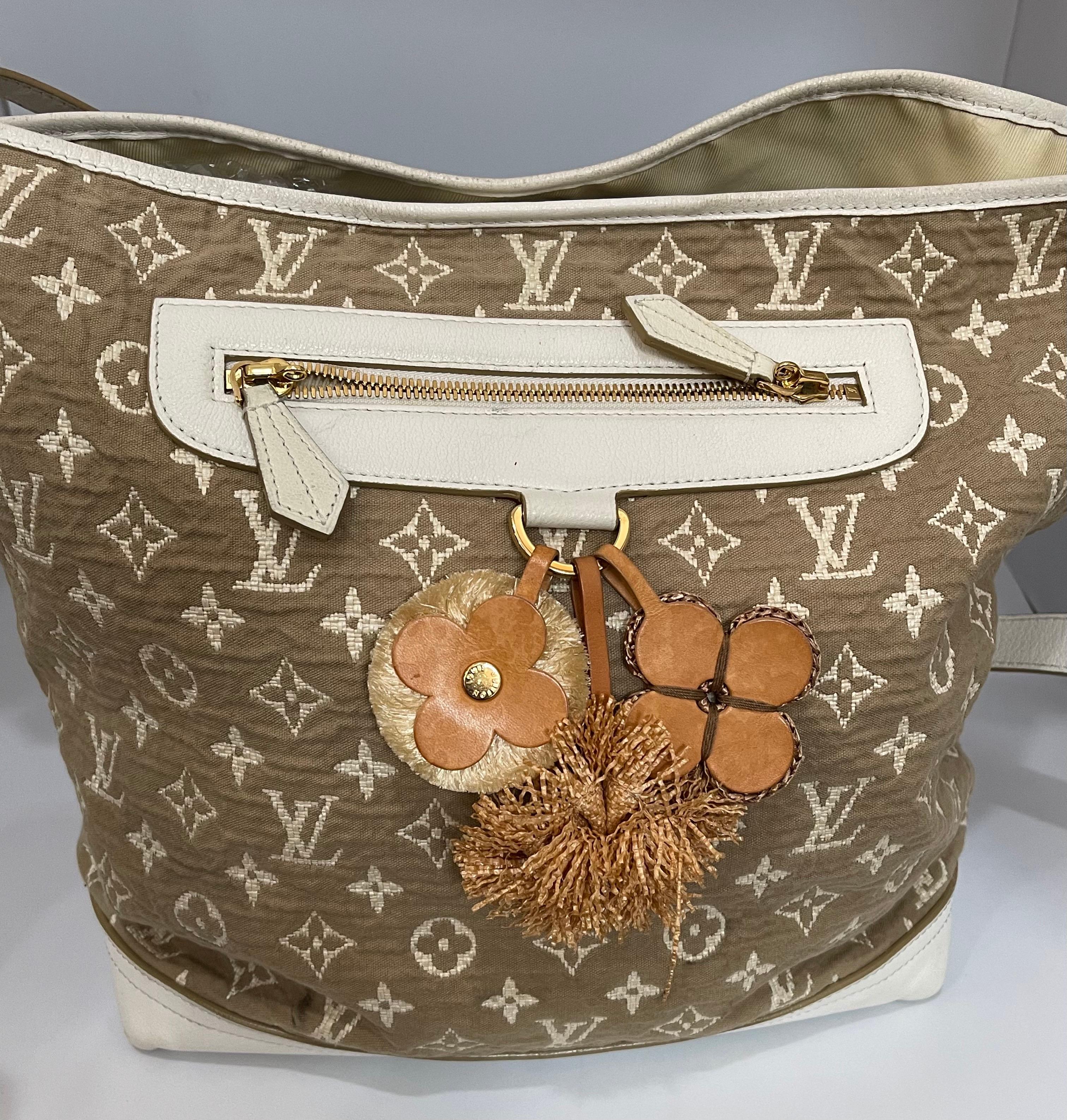 This is an authentic, pre-owned LOUIS VUITTON 
The vintage-inspired Cruise 2011 Monogram Sabbia bags are made from cotton based jacquard fabric that underwent a subtle coloration process to achieve a nice earthy color. The white leather trim and