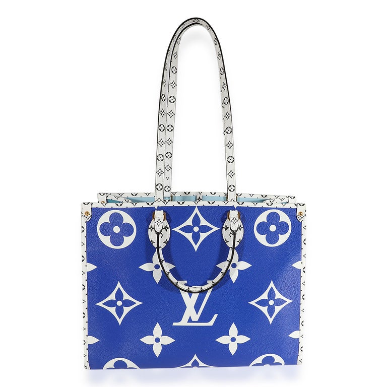 Listing Title: Louis Vuitton Limited Edition Blue Monogram Giant Hamptons Onthego
SKU: 123238
Condition: Pre-owned 
Handbag Condition: Very Good
Condition Comments: Very Good Condition. Scuffing and marks at corners and base. Faint scratching at