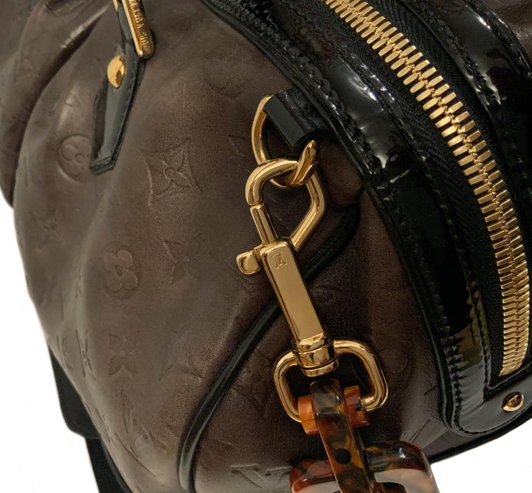 This pre-owned beautiful Limited Edition brown embossed Monogram Calfskin Bag from the house of Louis Vuitton is named after its creator, the artist Stephen Sprouse. 
Produced in very limited quantities and no longer available, the Stephen bag is