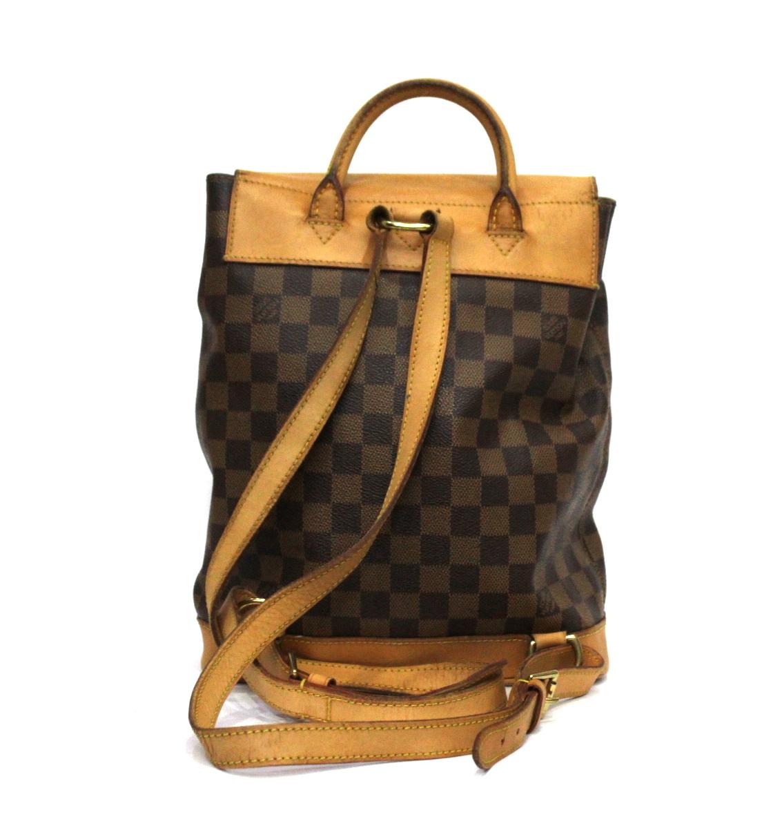 The Louis Vuitton Damier Canvas Soho Backpack Bag is great for ultimate hands-free convenience. This particular bag was the first line of Damier Canvas in the reintroduction of Damier Canvas in 1996 as Louis Vuitton celebrated their 100 year