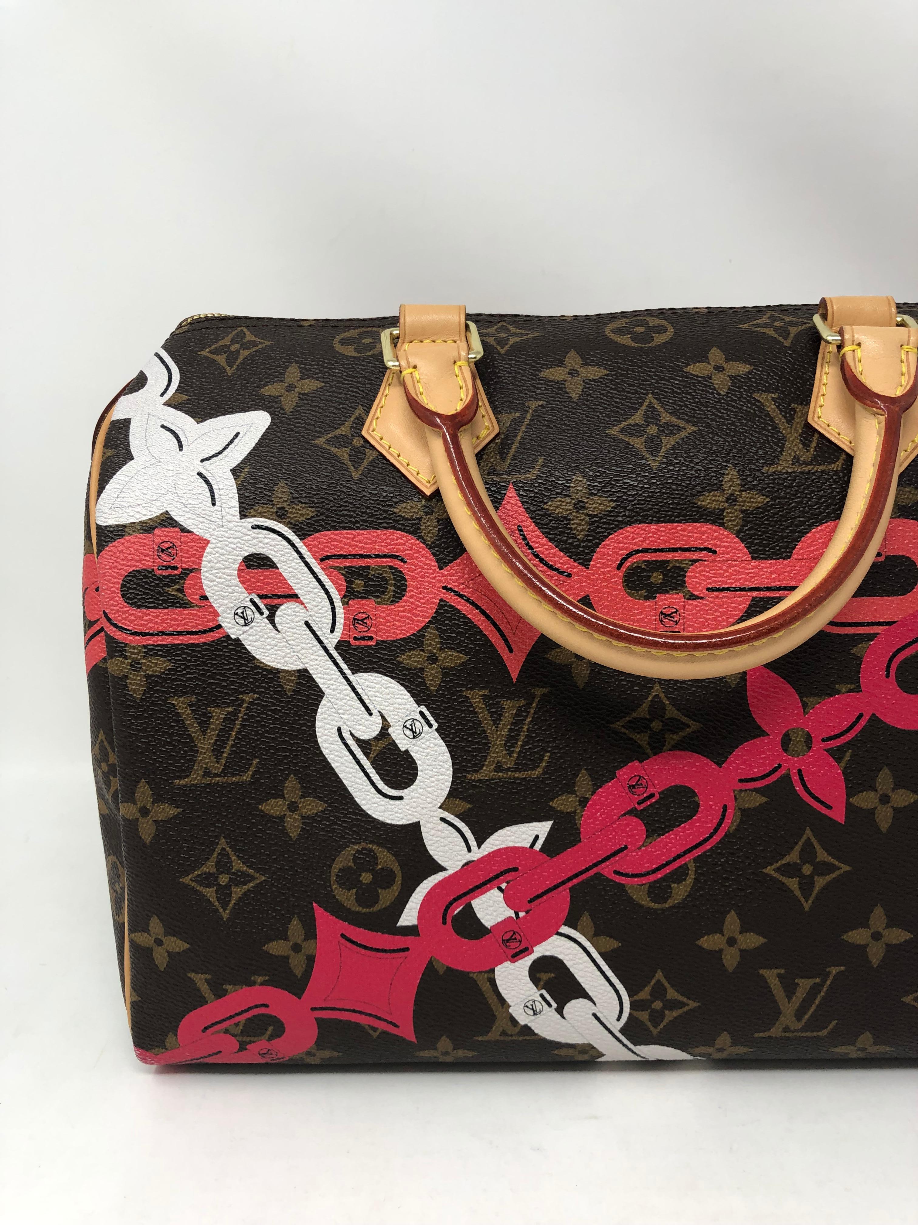 Louis Vuitton Limited Edition Monogram Canvas Chain Flower Speedy 30. Pink and white chain print on LV classic monogram. Stunning combination in this limited bag by LV. Like new condition on handles and exterior of bag. Worn only a few times.  From