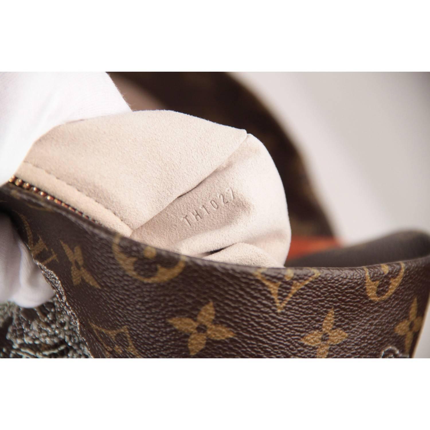 - Louis Vuitton Limited Edition  Silver Monogram Dentelle Fersen Bag
- Limited edition from the 2007 collection, created by Marc Jacobs 
- Brown monogram canvas with delicate silver-tone lace embroidery
- Front open pocket
- Magnetic button closure
