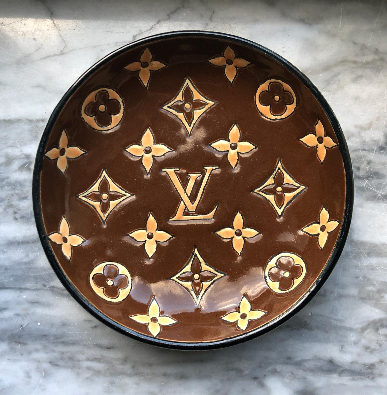 Louis Vuitton limited edition dish for Faïenceries et Emaux de Longwy, 1950s, France. A wonderful and neat porcelain glazed bowl made by Longwy painted with the iconic Louis Vuitton logo. It's one of few housewares by Louis Vuitton that came on the