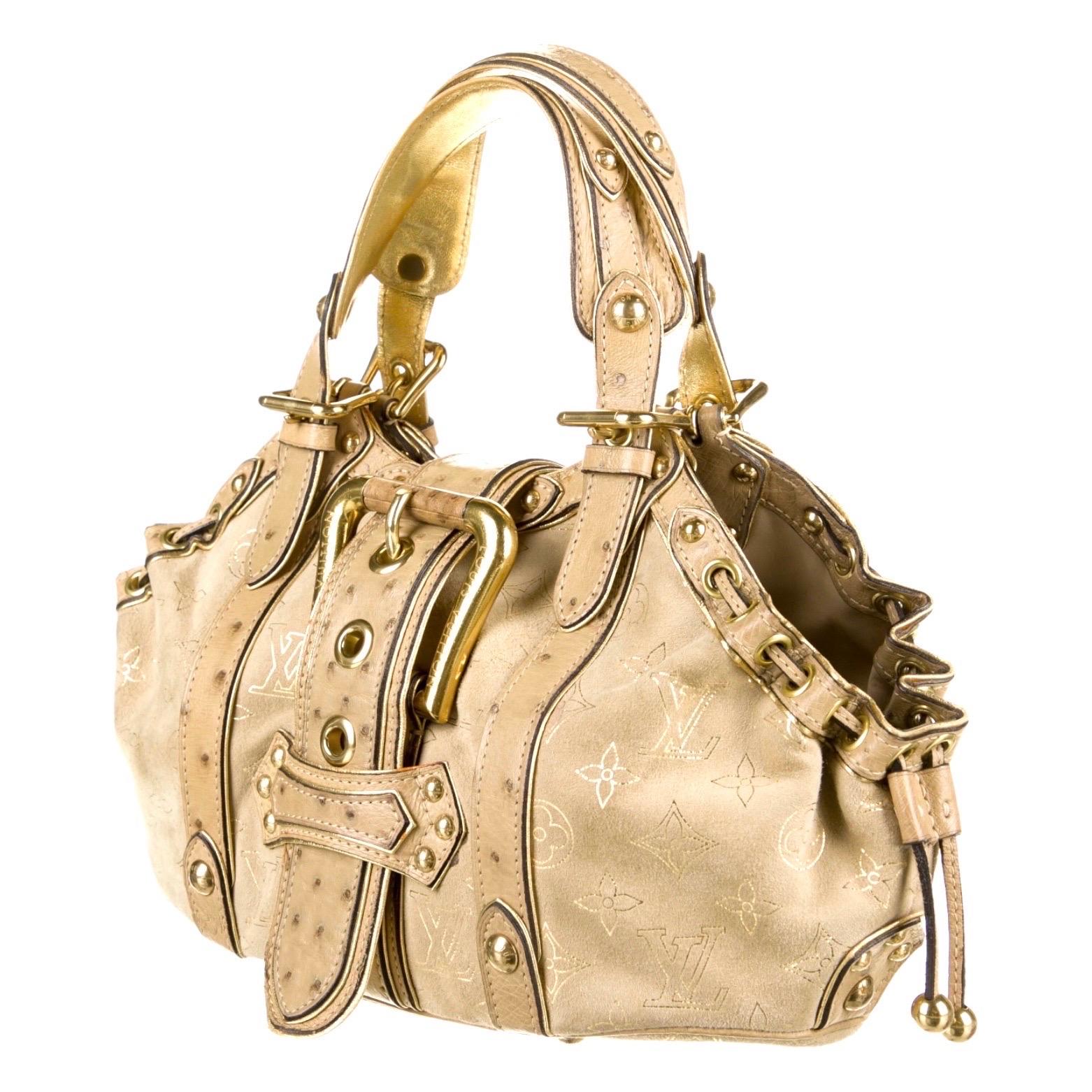 A stunning beige & gold suede and ostrich skin bag by Louis Vuitton
Designed by Marc Jacobs
This bag was produced in a very limited edition and made to order 
Finest suede leather imprinted with the famous LV monogram logo
Golden hardware
Ostrich