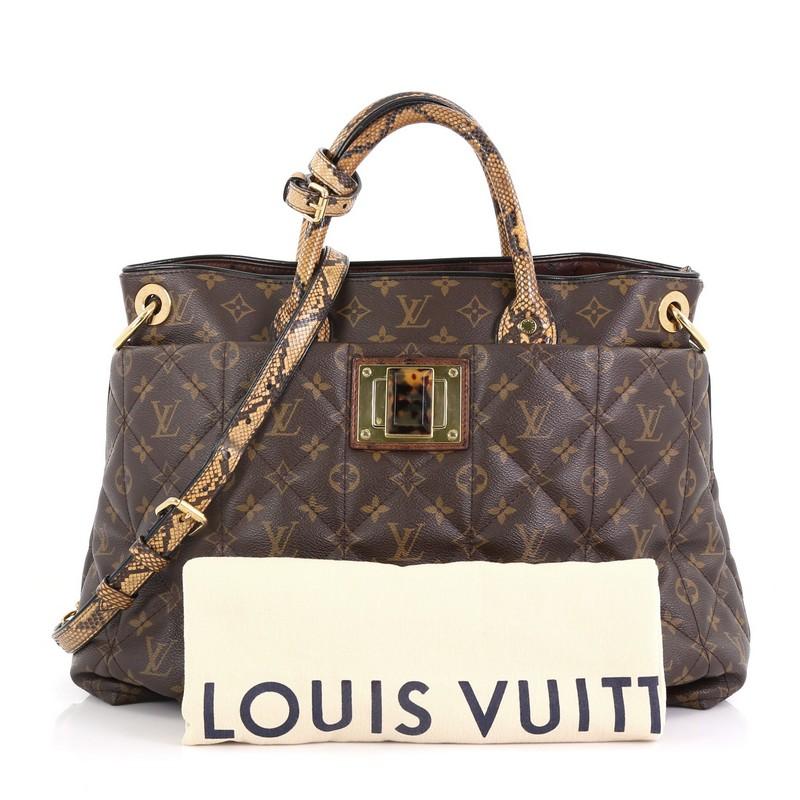 This Louis Vuitton Limited Edition Exotique Handbag Monogram Etoile GM, crafted from soft padded quilted brown monogram etoile coated canvas, features genuine python handles, oversized tortoise resin twist lock, and gold-tone hardware. It opens to a