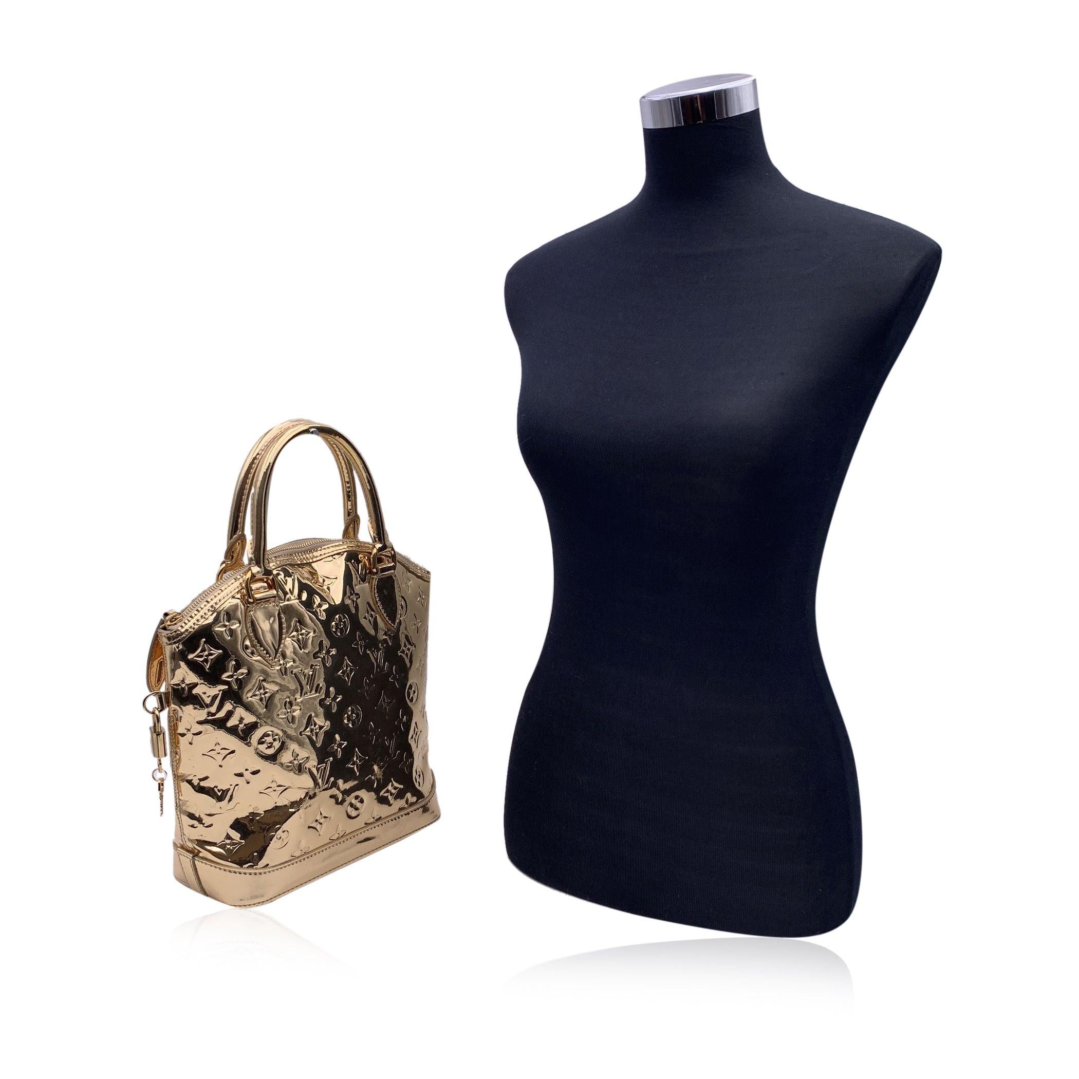 This beautiful Bag will come with a Certificate of Authenticity provided by Entrupy. The certificate will be provided at no further cost. Gorgeous Louis Vuitton Limited Edition Lockit Vertical from the 2007 collection. The Lockit Vertical is the