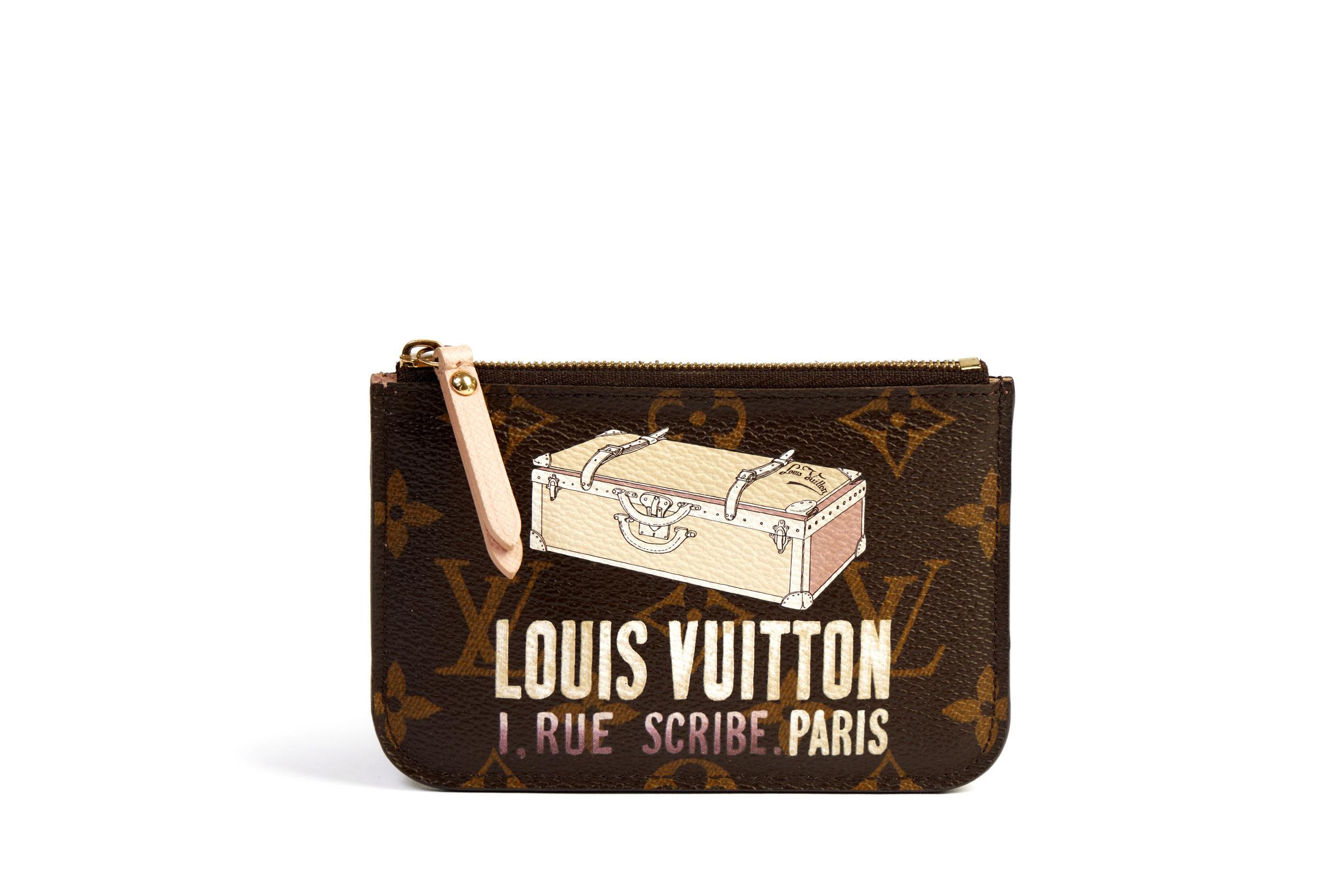 Louis Vuitton limited edition trunk keychain pochette. Back pocket and hidden chain. Monogram brown coated canvas and pink leather. Comes with original box.
