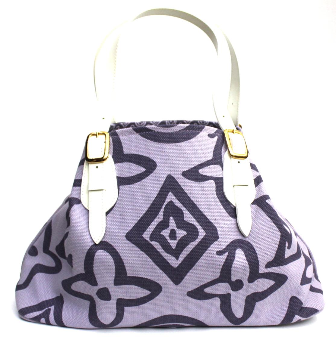 A chic and artsy blend makes this Louis Vuitton Limited Edition Lilac Tahitienne Cabas PM Bag truly desirable. This fabulous tote can be carried on the shoulder or on the arm and has a spacious interior. A 