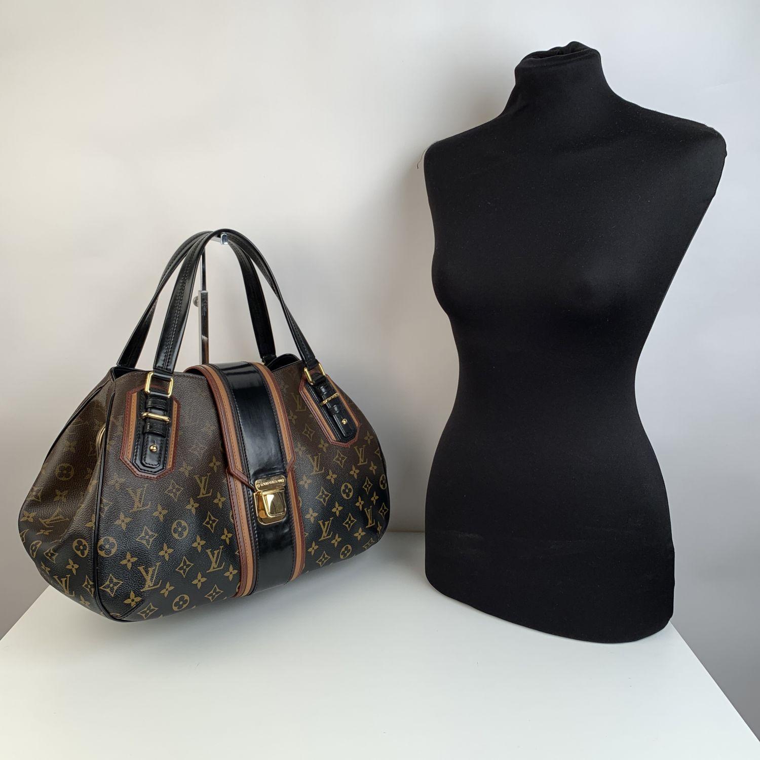 Louis Vuitton Monogram Noir Mirage Griet Bag Limited Edition creation from the 2007 Fall Collection. Very rare. The bag is carfted in timeless monogram canvas that gradually fades to black. Brown, black and mustard leather trim. Fold over strap with