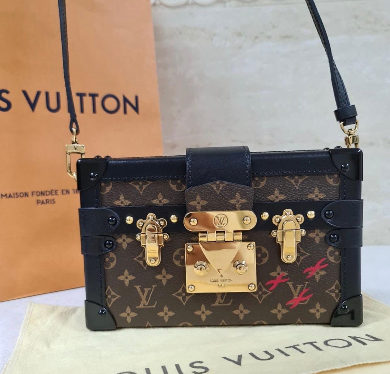 Inspired by their rich history of trunk making, the Louis Vuitton Petite Malle beautifully mixes the skilled craftsmanship of trunk construction with the effortless style of a modern day fashionista's crossbody bag. This adorable Petite Malle (