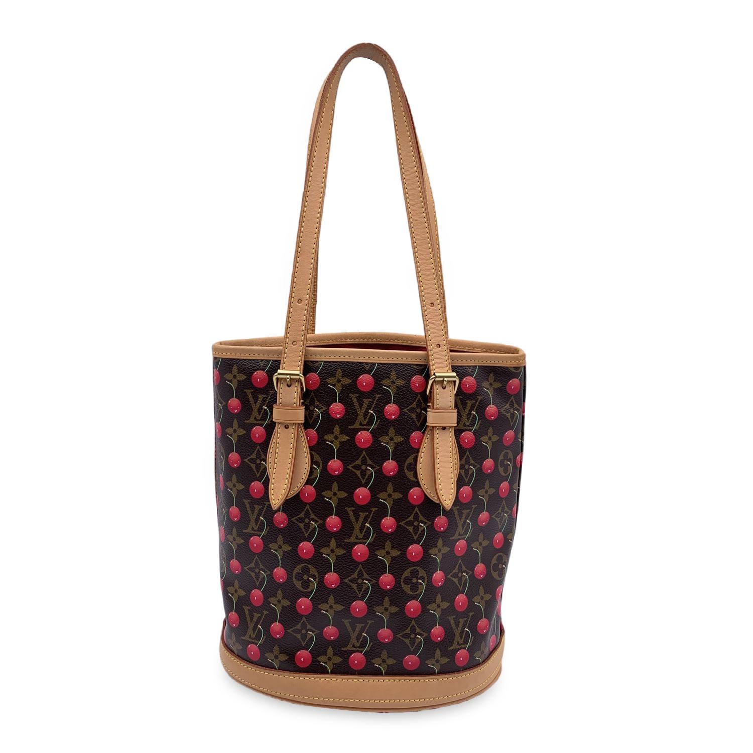 Limited edition LOUIS VUITTON X Takashi Murakami collaboration 'Bucket Bag' tote bag. Period/Era: 2005 - 'Cerises' collection by Takeski Murakami. Brown monogram coated canvas with bright cheerful cherry print. Rounded shape and open top. Double