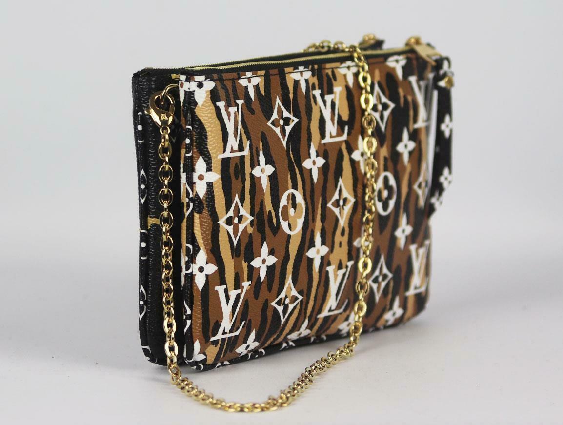 We're obsessed with bags with chains right now, and the 'Limited Edition Giant Jungle' bag from Louis Vuitton is at the top of our wish list, the style feastures a bold Monogram print on coated canvas in a leopard and zebra print, it features a