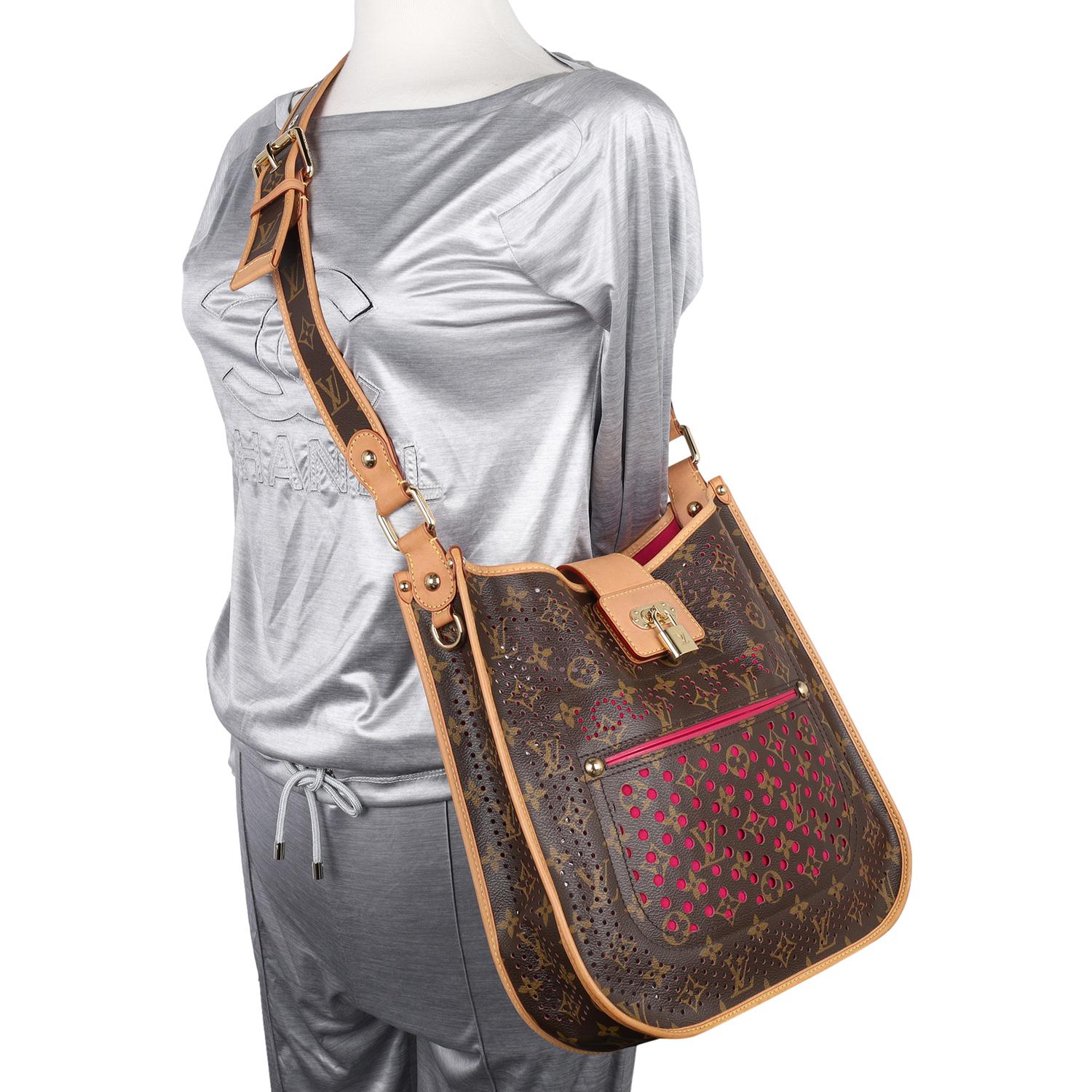 Authentic, pre owned limited edition Louis Vuitton perforated Musette shoulder bag. Don't miss out on your chance to own this spectacular and limited edition Louis Vuitton fuchsia monogram perforated Musette bag. Features monogram canvas that is