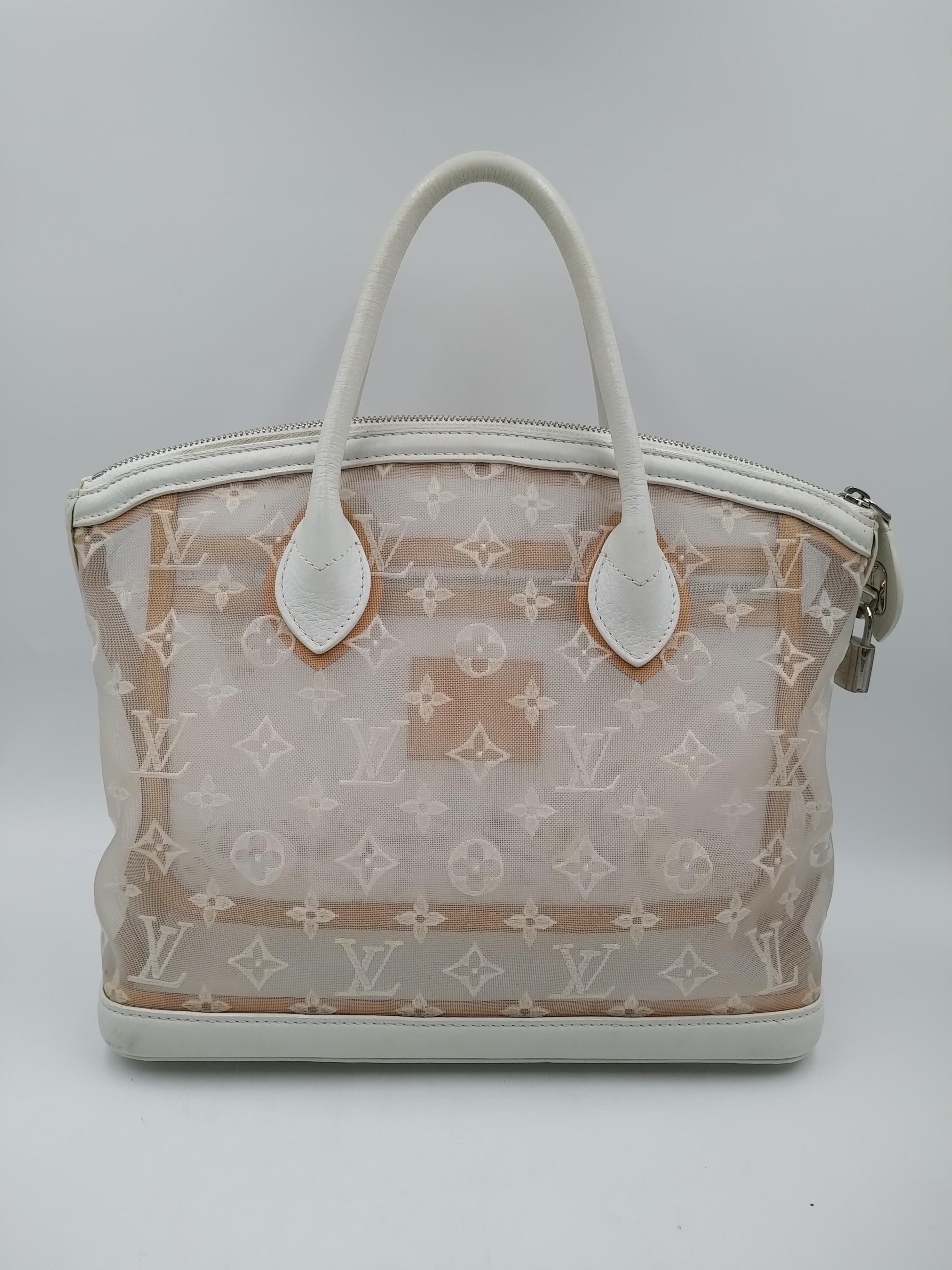 Louis Vuitton Limited Edition Monogram Transparence Lockit Bag, Marc Jacobs created the Spring/Summer 2012 Transparence line to exude sweetness and lightness.
- 100% Authentic Louis Vuitton
- Monogram embroidered sheer nylon with white calfskin