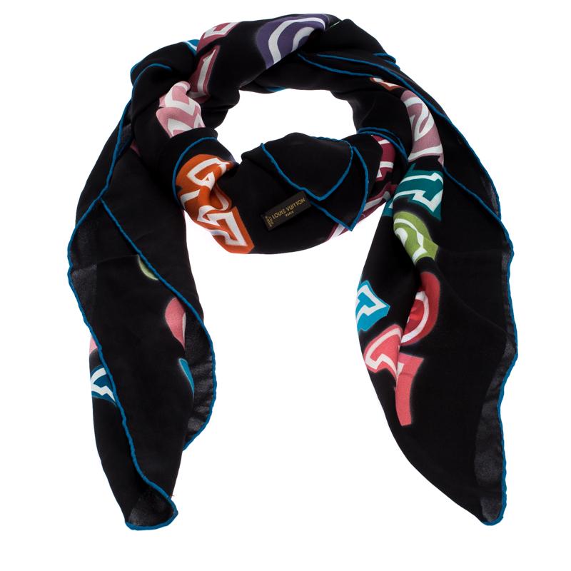 Tie this classy Louis Vuitton limited edition square-shaped scarf around your neck for a bold look. Cut out from silk, it features multicolored lettering over a black base.

Includes: The Luxury Closet Packaging

