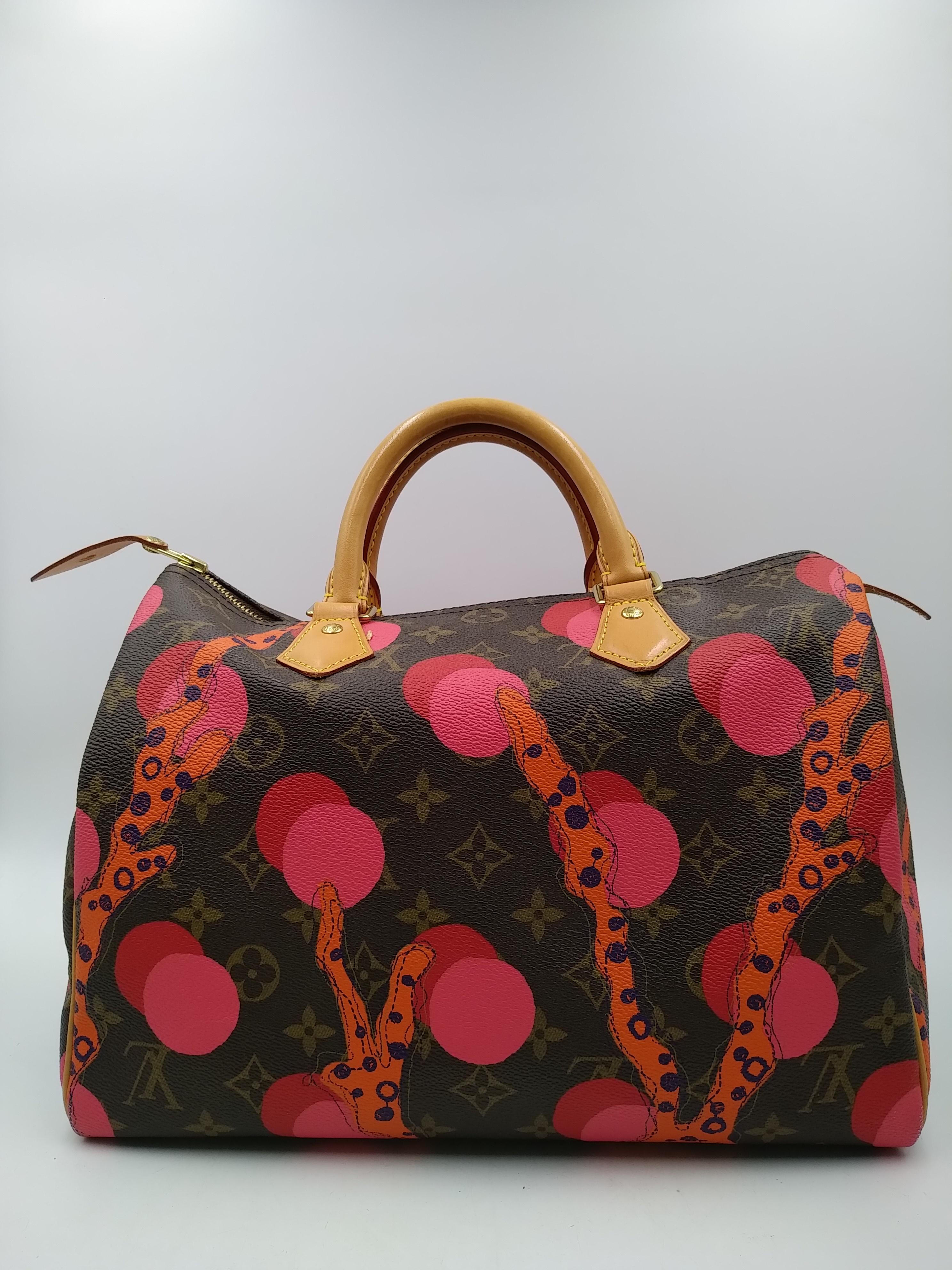 Louis Vuitton Limited Edition Ramages Grenada Speedy 30 bag. Inspired by the underwater world of coral, the Monogram Ramages collection for summer 2015 features bold screen-printed polka dots and coral in Grenade on the iconic Monogram canvas.
-100%