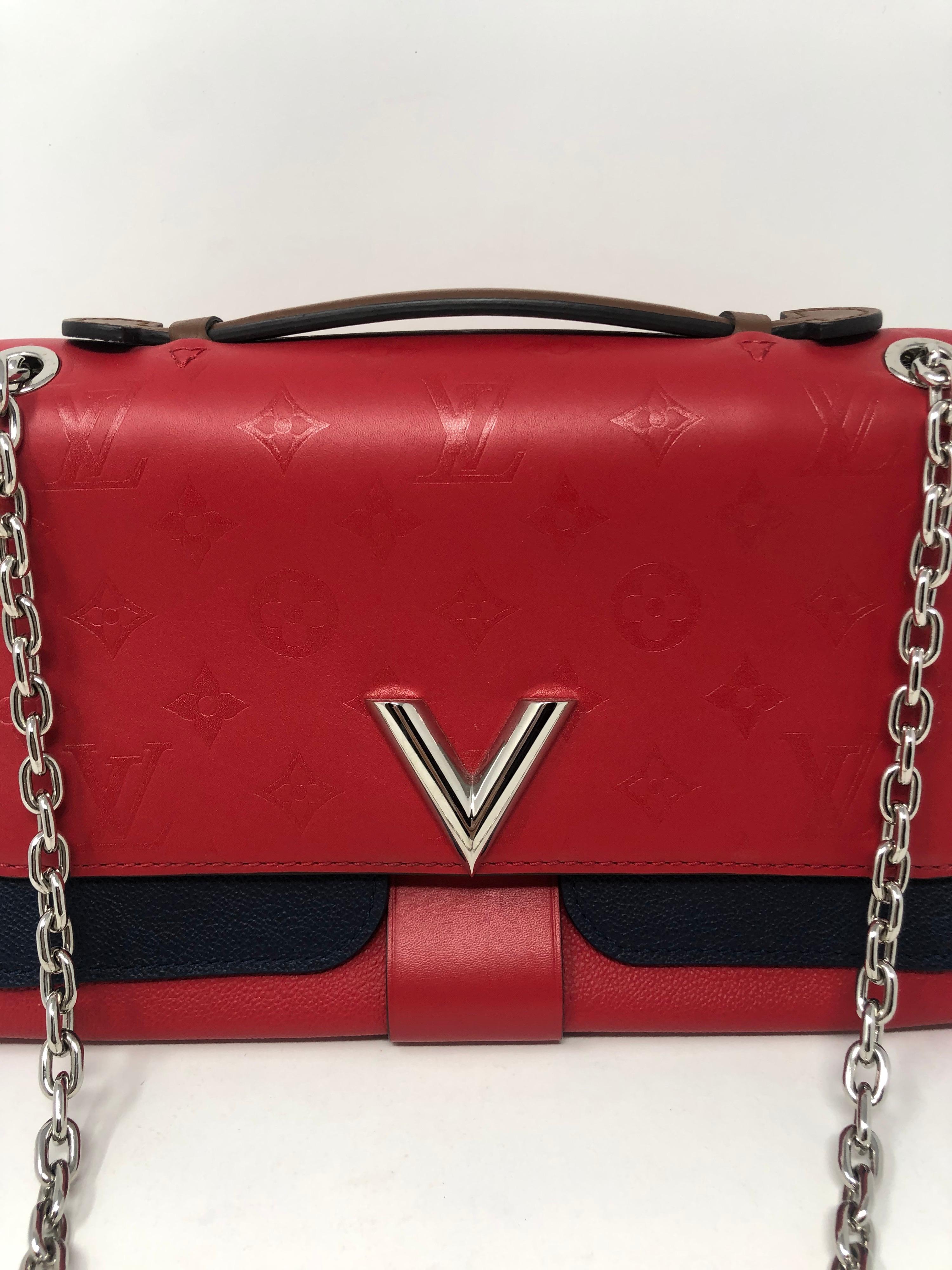 Louis Vuitton Limited Edition Red and Navy Crossbody Bag. Silver hardware. Brand new condition. Unique and beautiful bag. Plastic still on hardware. Guaranteed authentic. 