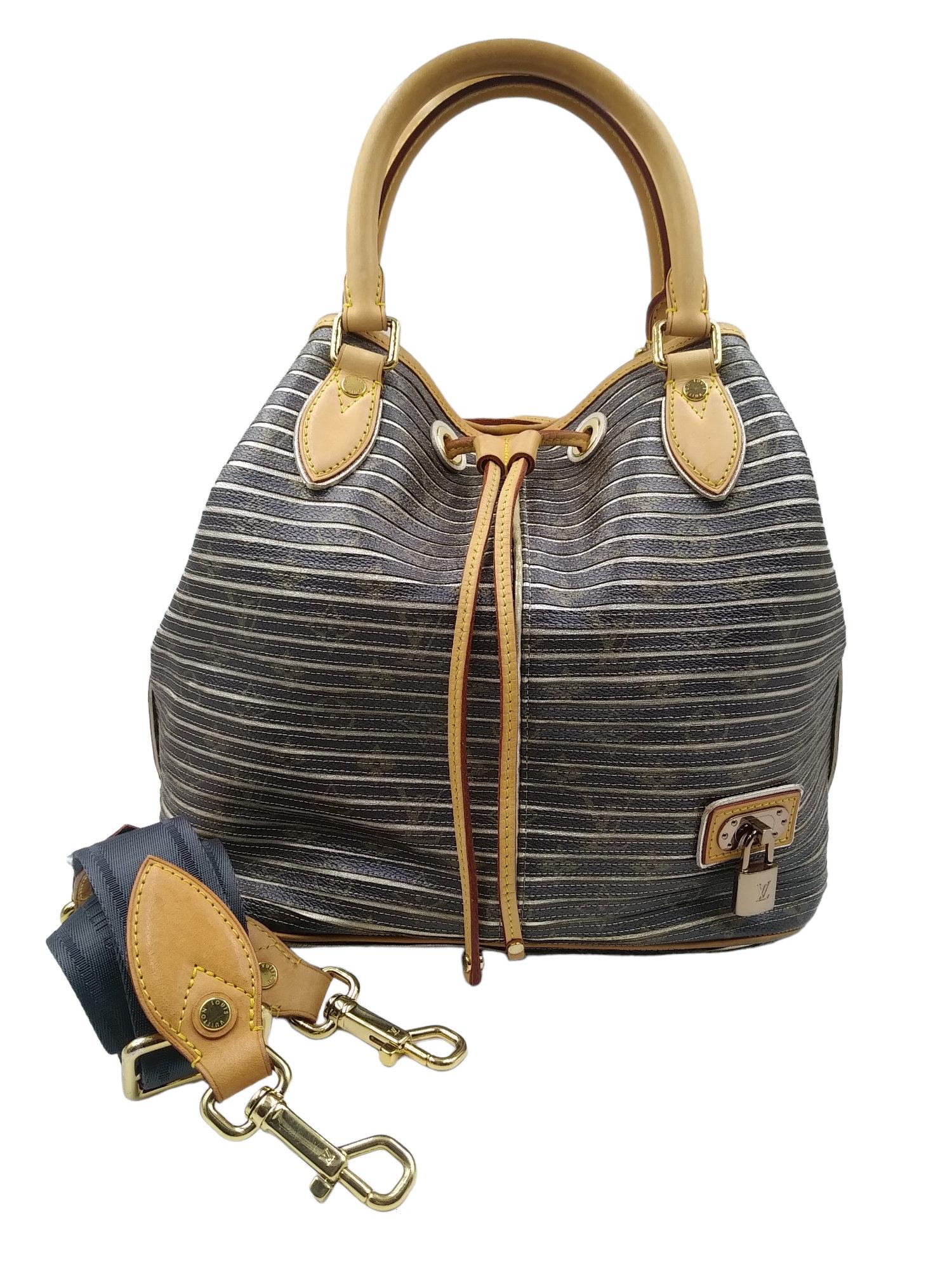 Louis Vuitton Limited Edition 2010 Silver Monogram Eden Neo Bag
- 100 authentic Louis Vuitton
- Monogram coated canvas with metallic leather and cowhide leather trim
- Double rolled leather handles and removable, adjustable nylon shoulder strap
-