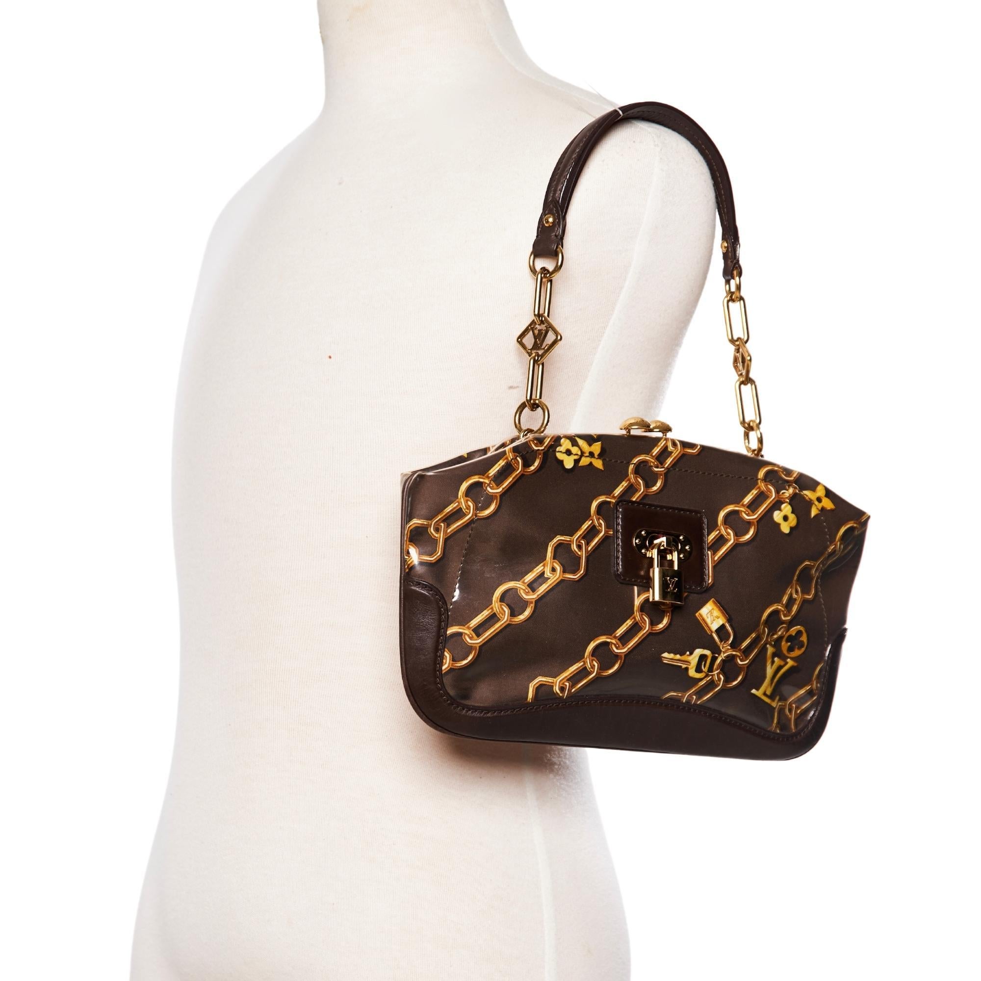 Designed by Marc Jacobs for the spring/summer 2006 collection, only available for VIP customers, this line was inspired by the 1960's It features a Monogram Charm print on silk protected by crystal vinyl trimmed with dark brown leather. The bag also