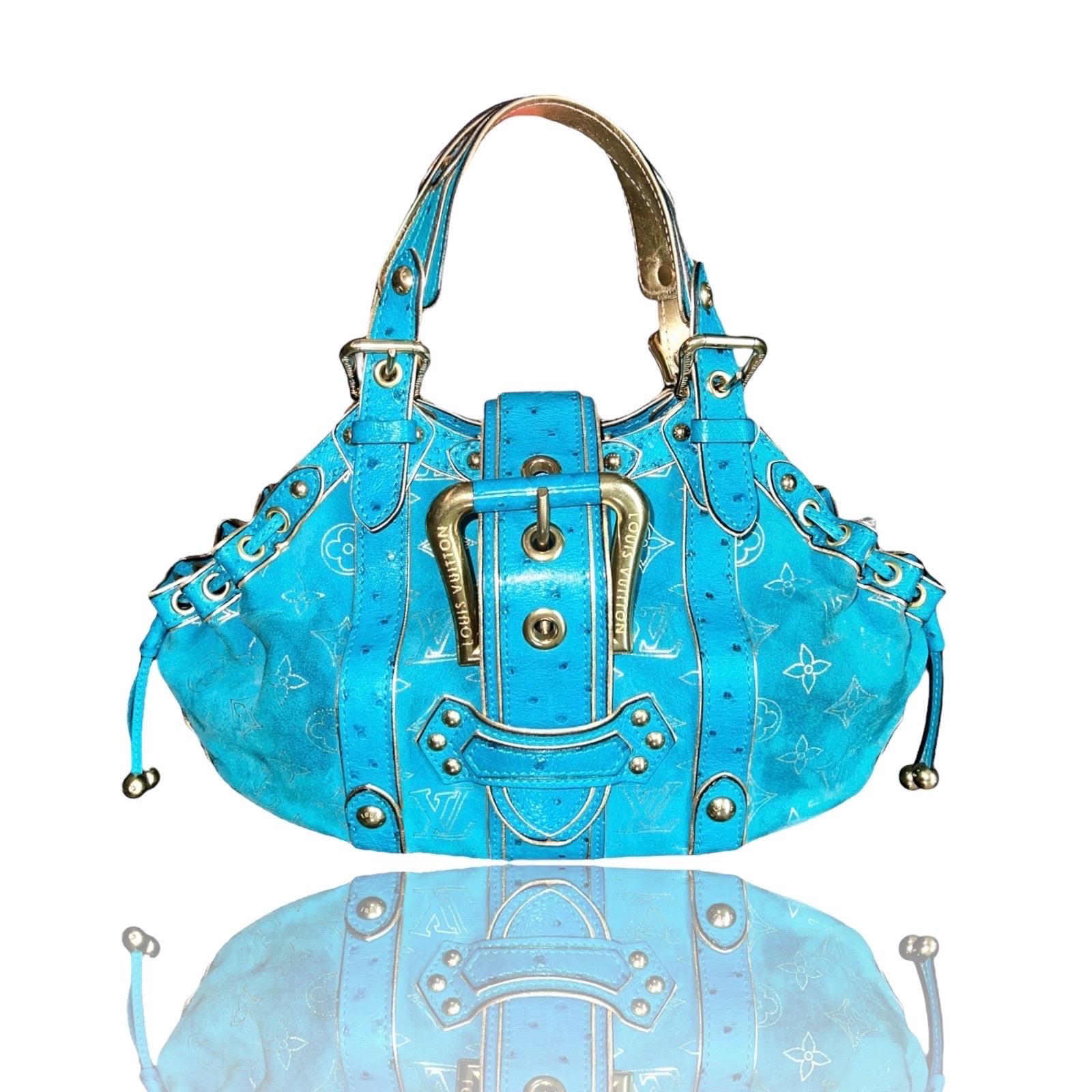 A stunning turquoise & gold suede and ostrich skin bag by Louis Vuitton
Designed by Marc Jacobs
This bag was produced in a very limited edition and made to order 
Finest suede leather imprinted with the famous LV monogram logo
Golden hardware
Edges