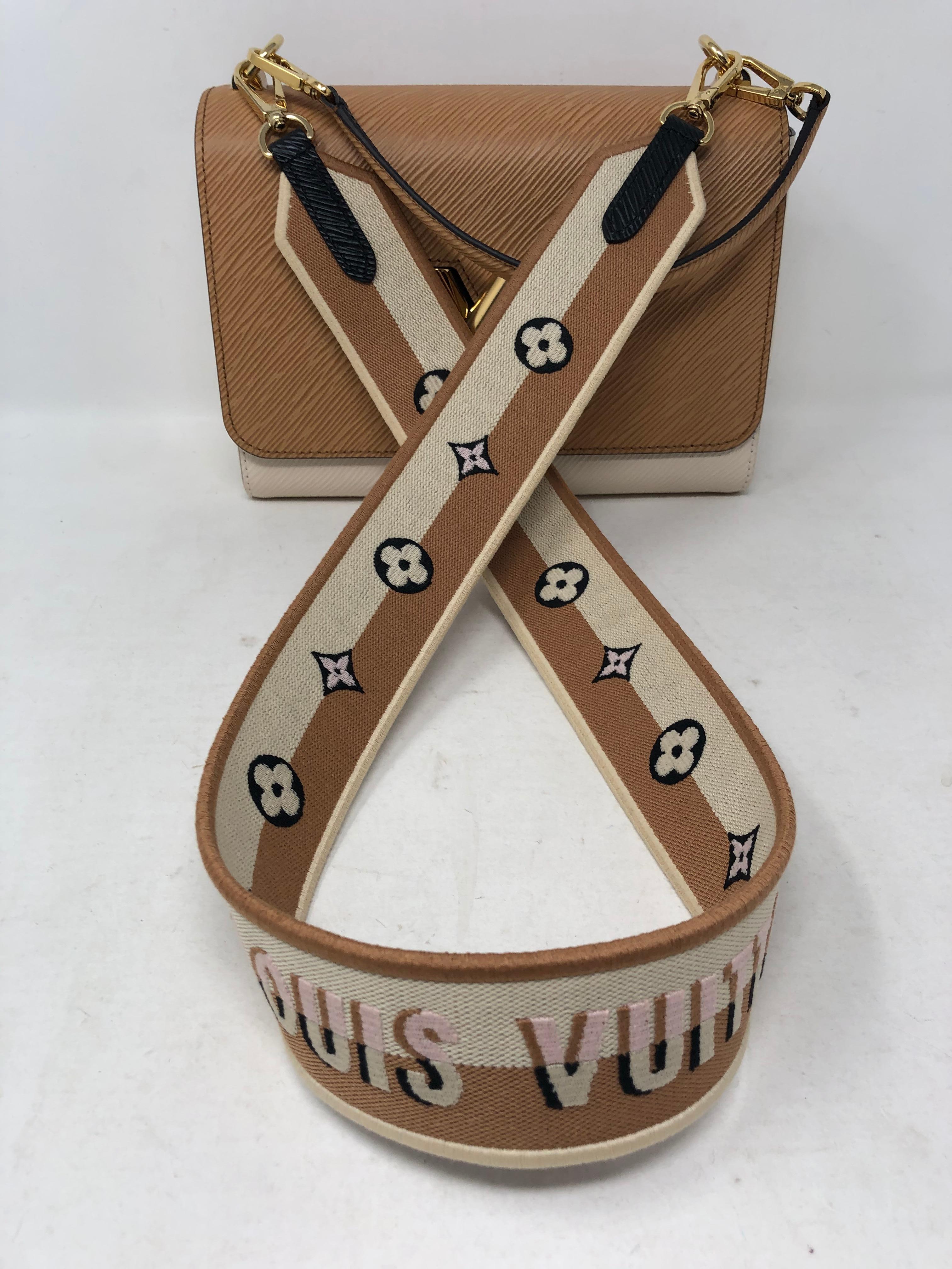 Louis Vuitton Limited Edition Epi Leather Two-tone Twist Bag. Brand new never used. Unique interlocking clasp spells LV. Gold hardware. Own this rare and unique piece. Includes original dust cover and box. Guaranteed authentic. 