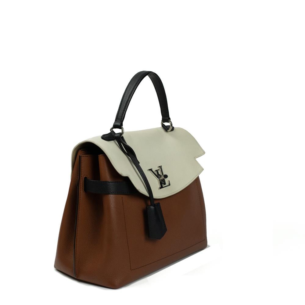 - Designer: LOUIS VUITTON
- Model: Lock me ever 
- Condition: Very good condition. Bag restored by a professional, Stain on the front of the bag, Scratches on the clasp, Minor sign of wear on base corners
- Accessories: Strap (Removable &