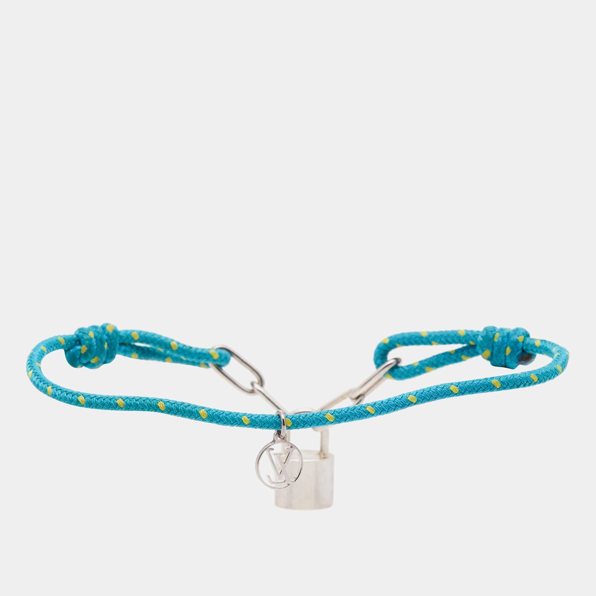 This Louis Vuitton for UNICEF collection is a beautiful celebration of childhood. This bracelet from the line has a blue cord that holds the LV logo engraved padlock smoothly sculpted from sterling silver.

Includes: Original Dustbag, Original Box,