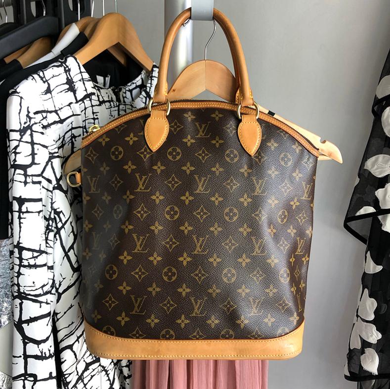 Louis Vuitton Lockit Vertical Monogram Double Handle Bag.  Double rolled vachetta leather handles, zippered top, flat rectangular base.  Date code FL0066 for production year 2006.  Measures 11 x 11.5 x 5