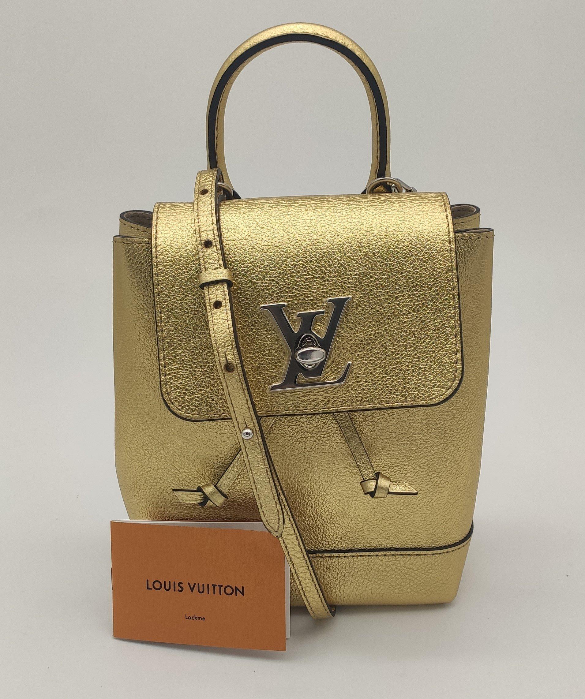 - Designer: LOUIS VUITTON
- Model: Lockme
- Condition: Very good condition. 
- Accessories: Dustbag, Purchase tag
- Measurements: Width: 18cm, Height: 21cm, Depth: 9cm, Strap: 75cm
- Exterior Material: Leather
- Exterior Color: Gold
- Interior