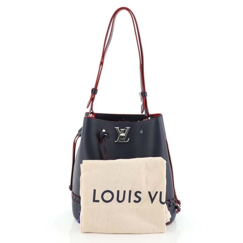 This Louis Vuitton Lockme Bucket Bag Braided Leather, crafted in blue leather, features a leather shoulder strap, leather thread that cinches the bag, braided detailing, and silver-tone hardware. Its LV turn-lock closure opens to a red microfiber