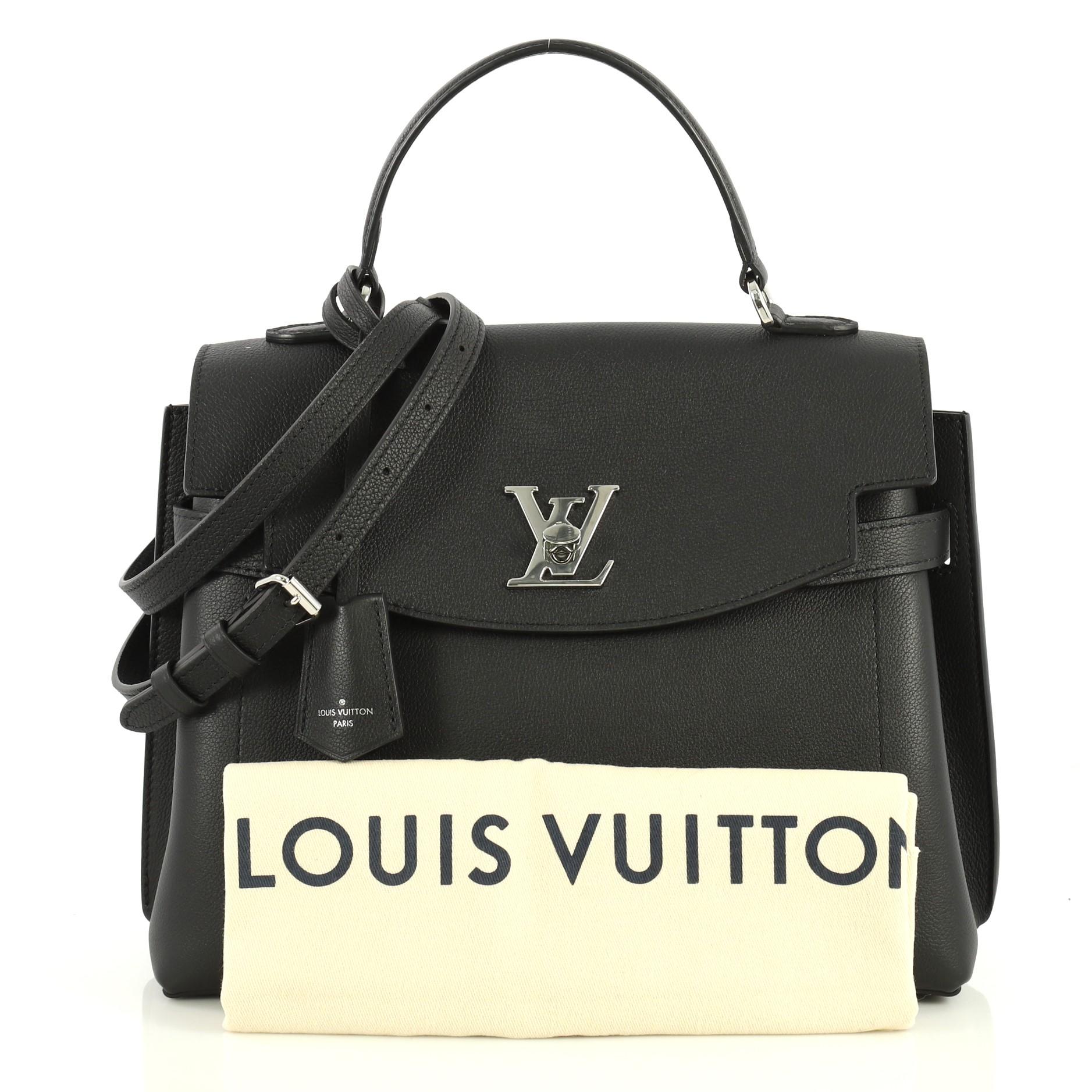 This Louis Vuitton Lockme Ever Handbag Leather MM, crafted in black leather, features a single loop leather handle and silver-tone hardware. Its flap with turn-lock closure opens to a black microfiber interior with slip pockets. Authenticity code