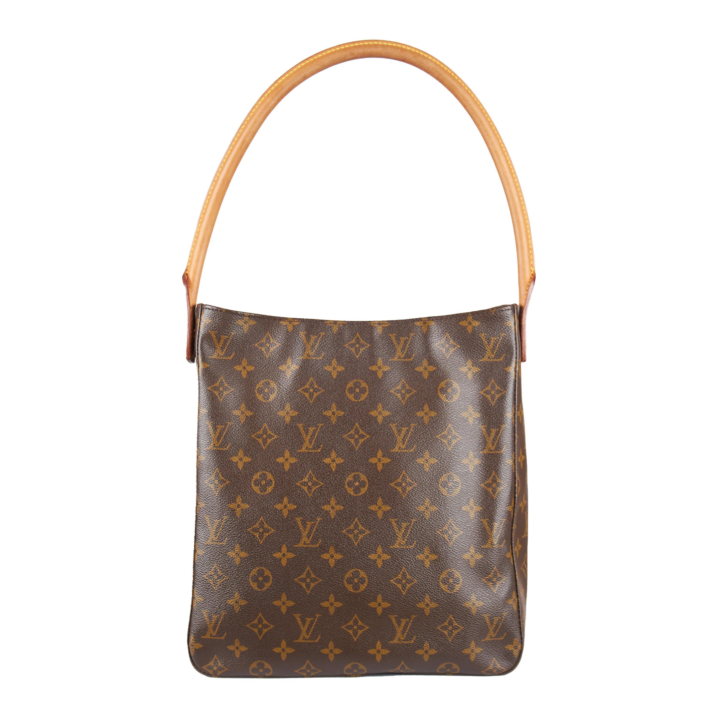 This Louis Vuitton Looping GM Monogram Shoulder Bag coated canvas from the 2000s, features a classic top handle, made of brown coated canvas with monogram print and gold tone hardware. The zip closure at the top ensures reliable security while the