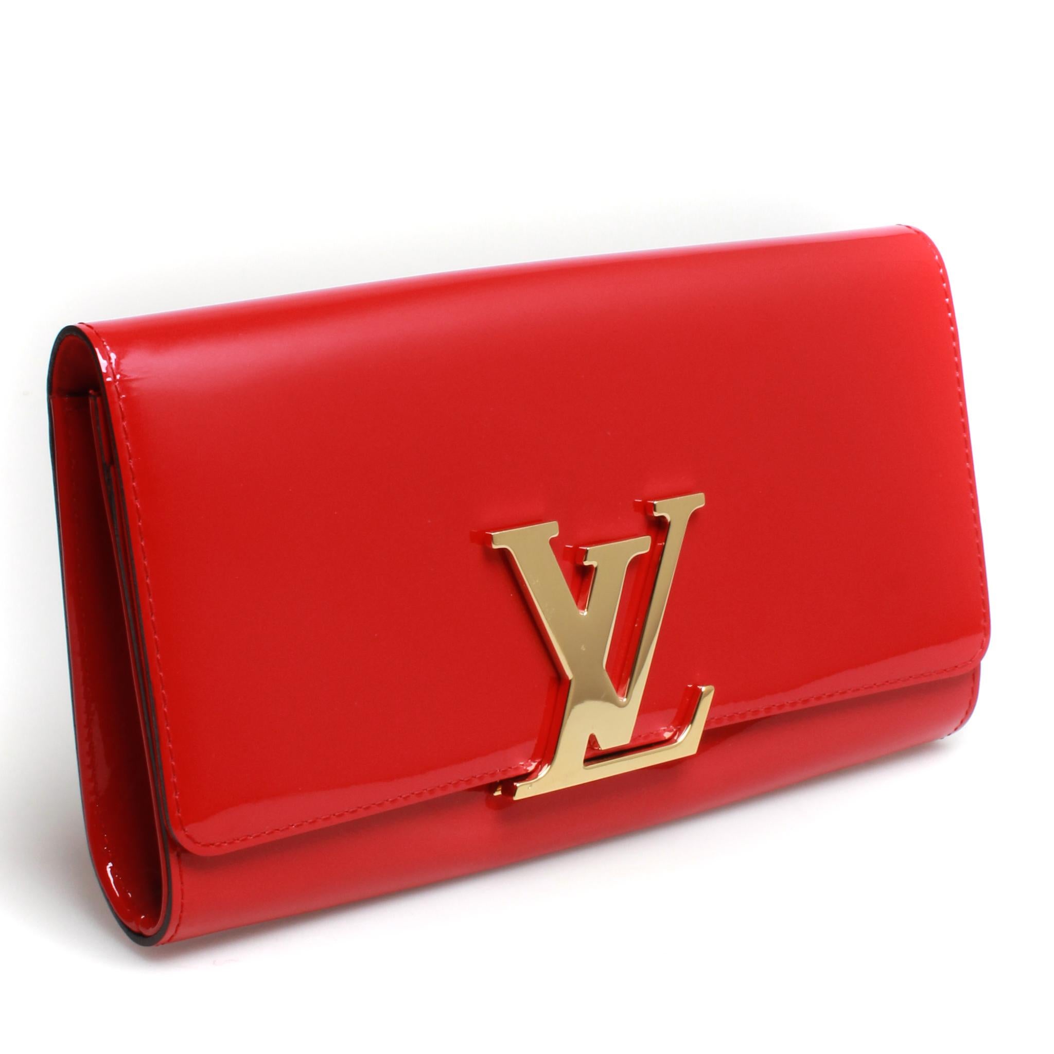 Louis Vuitton rouge vernis leather Louise clutch with front flap and brass hardware detailing.
Original dust bag and box.
