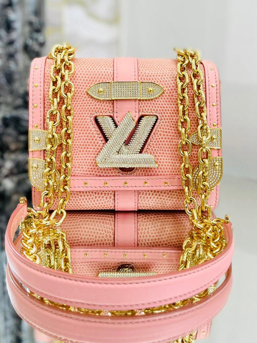 Rare Item - Louis Vuitton Lizard Skin & Crystal Trunk/Twist Lock Bag

Very rare ltd edition bag. Crossbody trunk style bag in pink exotic skin with gold hardware. Twist lock 

closure and other hardware to the front having crystals set through