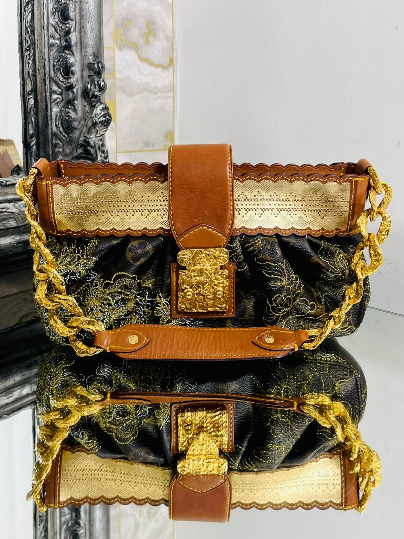 Louis Vuitton Ltd Edition Monogram Dentelle Kirsten Bag

Brown 'LV' logo coated canvas, with a delicate lurex lace trim in gold.

Embroidered metallic gold thread in a floral pattern to the body of the bag.

Chunky gold chain strap and hardware.