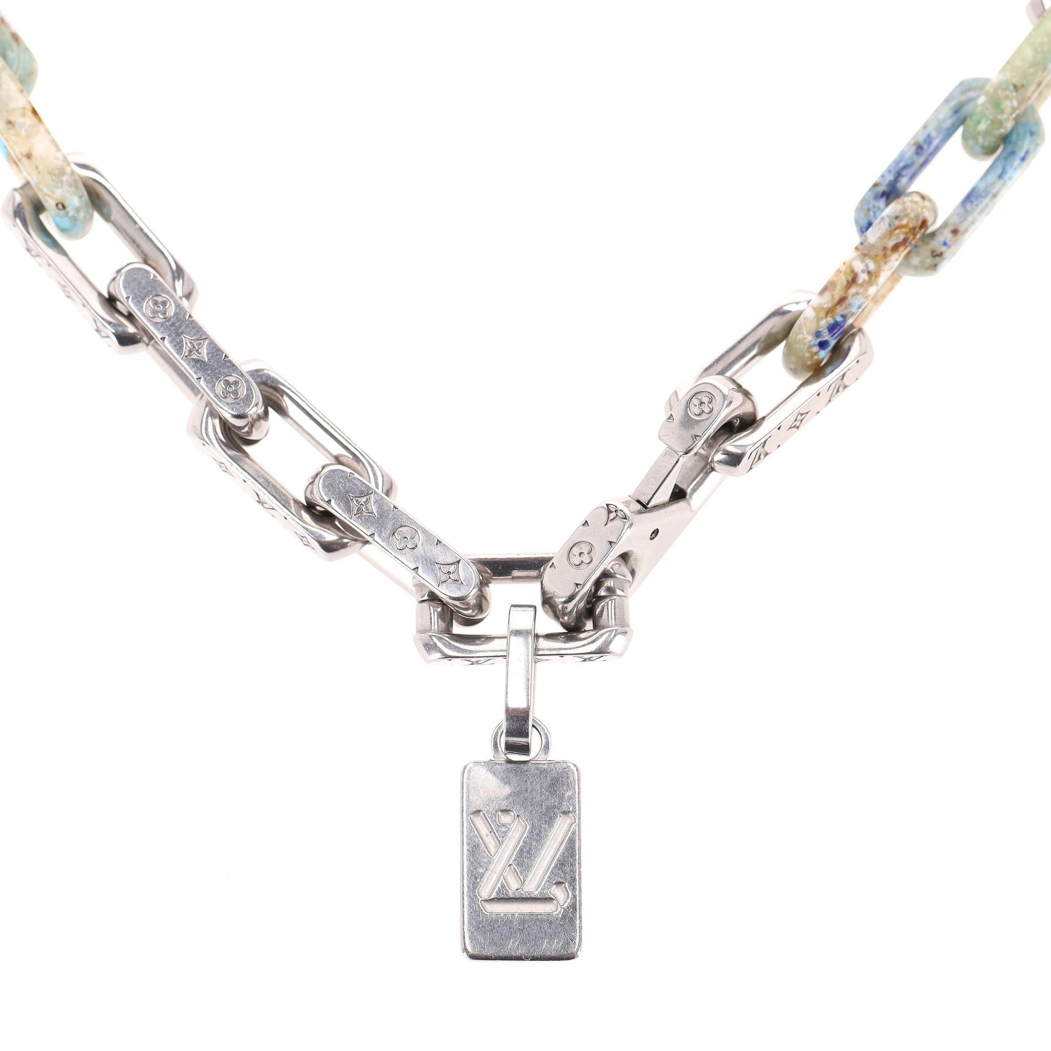 Rare Item - Louis Vuitton Ltd Edition Monogram Multi Linked Chain Necklace By Virgil Abolah

Limited edition silver linked chain necklace designed with silver links engraved with LV Monogram flowers and LV initials with marbled resin links in the