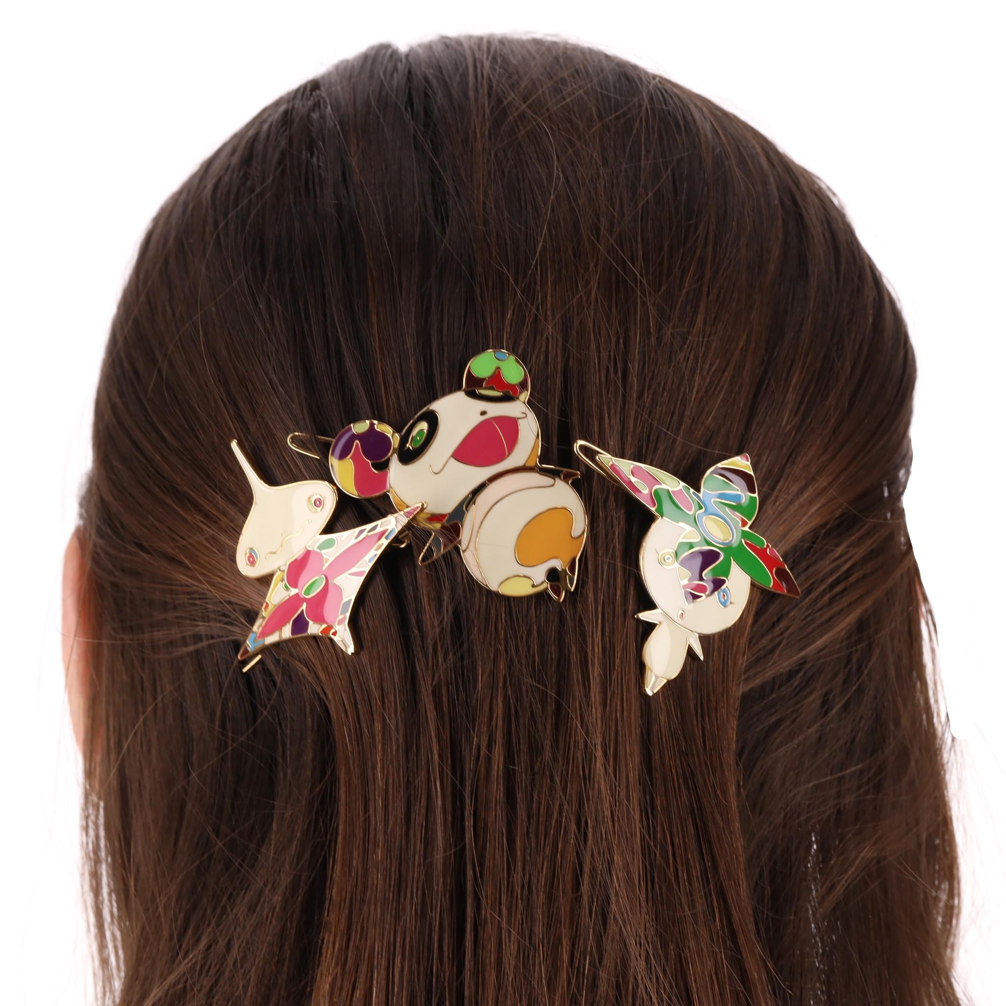 Louis Vuitton Ltd Edition Takashi Murakami Collection Hair Clips

Set of three brass and enamel Louis Vuitton Panda hair barrettes with monogram accents throughout and hinged clasp closure at back.

Rrp Approx. £1,200

Size - One Size

Condition -