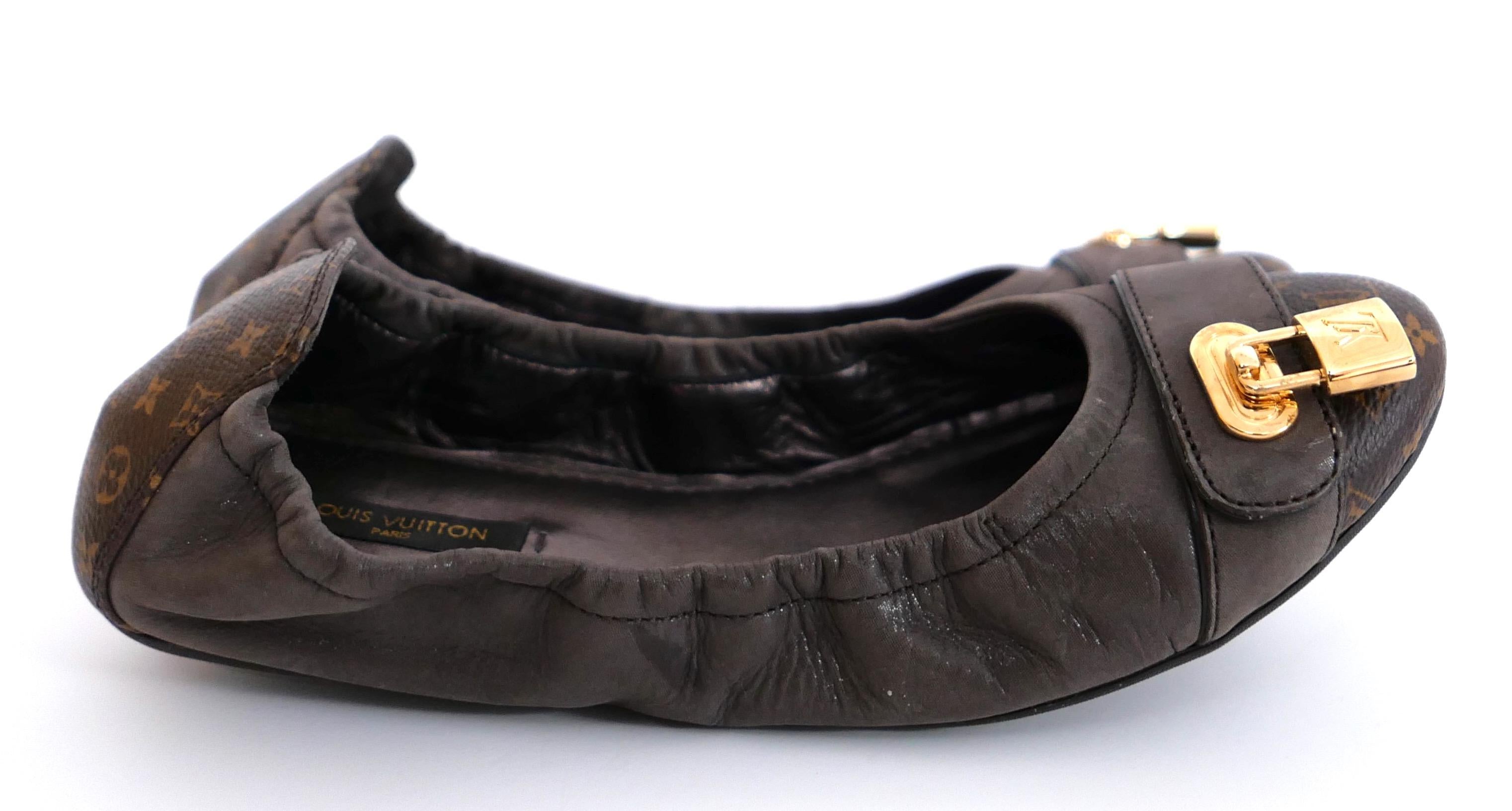 Cute and chic Louis Vuitton Lucky ballet flats. Worn once with dustbag. Made from brown nubuck leather and monogram canvas. They have goldtone padlock charms to fronts, elasticated sides and flexible soles. Size 38. Measure approx 9.75” heel to toe