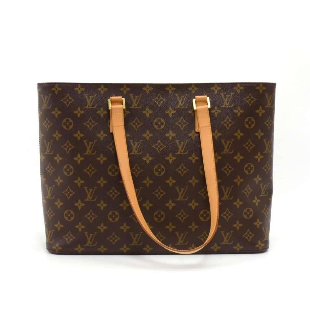 Louis Vuitton Luco large tote crafted in canvas monogram. Top is secured with brass zipper. Inside is beige alkantra with  one zipper pocket and 3 open pockets. Has a very spacious interior. It can be comfortably carried on thee shoulder with the