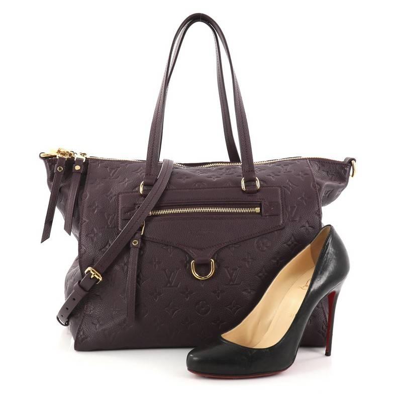 This authentic Louis Vuitton Lumineuse Handbag Monogram Empreinte Leather PM showcases everyday sophistication. Crafted in purple monogram empreinte leather, this functional tote features an exterior front zip pocket, dual-flat handles and gold-tone