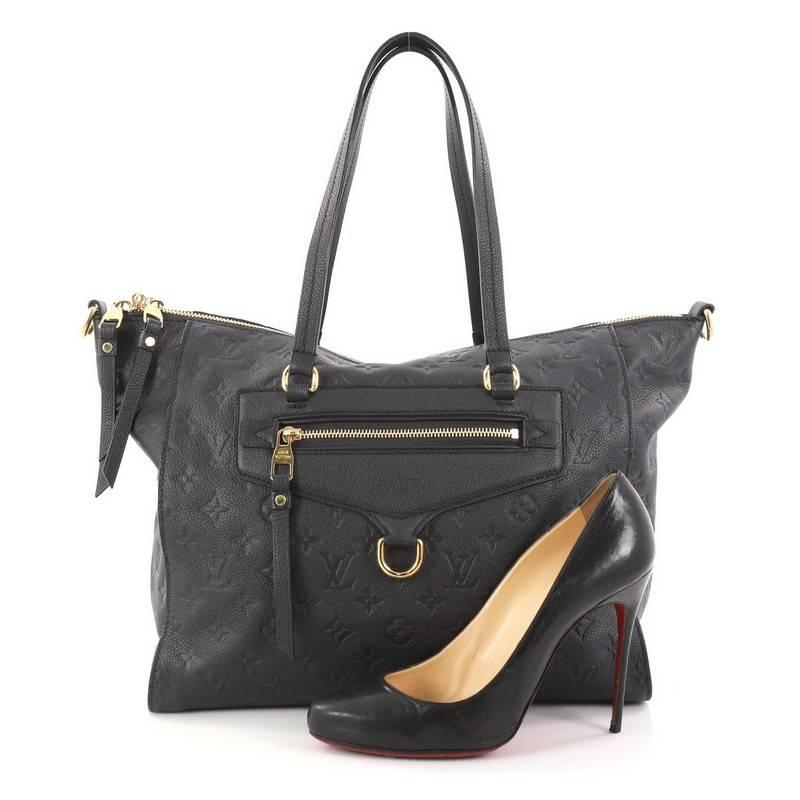This authentic Louis Vuitton Lumineuse Handbag Monogram Empreinte Leather PM showcases everyday sophistication. Crafted in navy monogram empreinte leather, this functional tote features an exterior front zip pocket, dual-flat handles and gold-tone