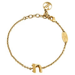 Louis Vuitton LV & Me Goldfarbenes Armband mit N-Ton-Charm