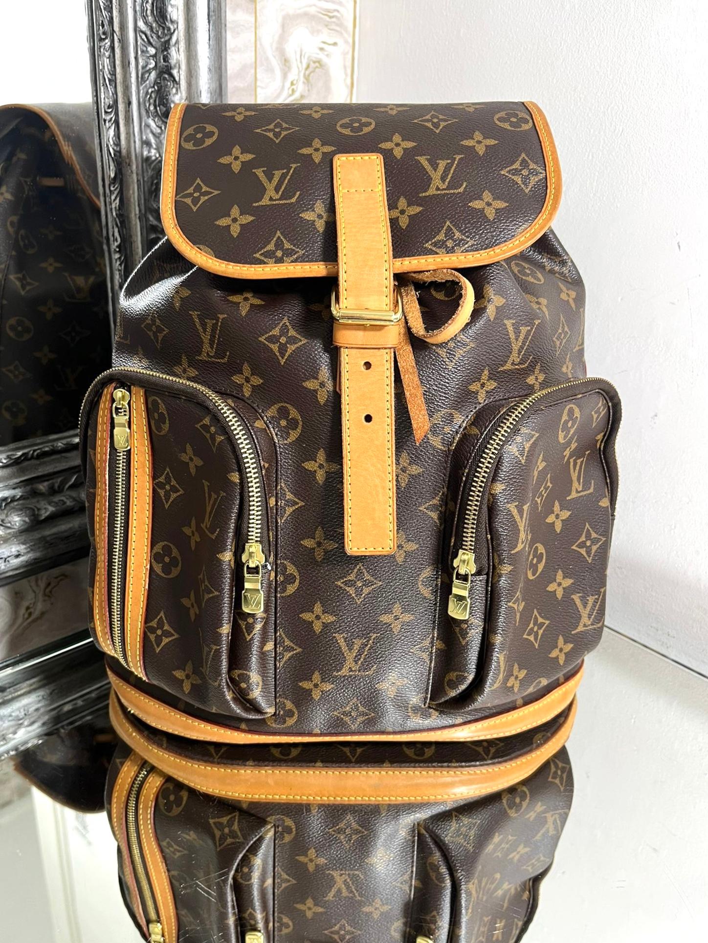 Louis Vuitton 'LV' Monogram Bosphore Backpack

Brown logo coated canvas bag with leather accents and gold logo hardware.

Draw string inner closure, flap buckle outer closure, zipper pockets and 

adjustable shoulder straps.

Size - Height 37cm,