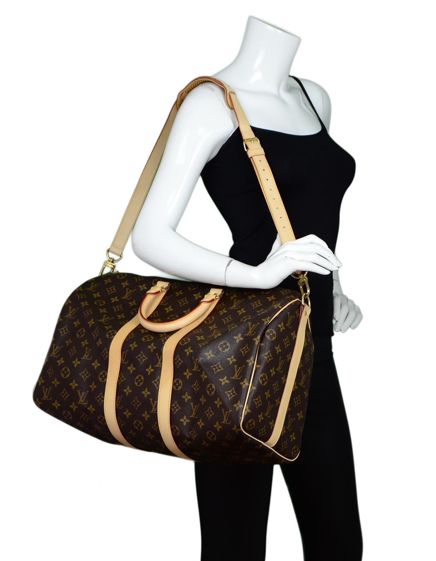 Louis Vuitton LV Monogram Canvas Keepall Bandouliere 45 Duffle Bag W/ Lock & Keys Unisex

Made In: France
Year of Production: 2009
Color: Brown/tan
Hardware: Goldtone
Materials: Coated canvas, leather
Lining: Brown canvas
Closure/Opening: Zip top
