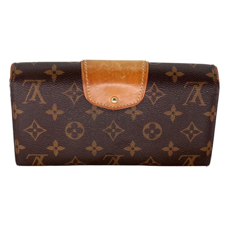 Louis Vuitton LV Monogram GM Boetie Long Wallet LV-1203P-0004

Collectible Louis Vuitton wallet is made from traditional brown Monogram canvas with natural leather trim and golden brass hardware. Details include a turn-lock closure and organized