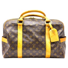 Louis Vuitton LV Monogram Keepall Duffle Boston Bag Brown with lock, luggage tag
