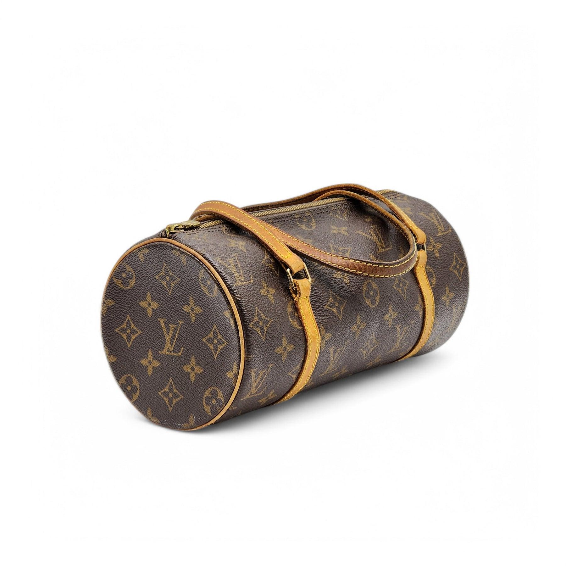 This iconic Louis Vuitton Papillon shoulder bag is crafted from the signature brown LV monogram coated canvas, offering a timeless and versatile style perfect for any occasion. The classic cylindrical shape and durable canvas construction make it