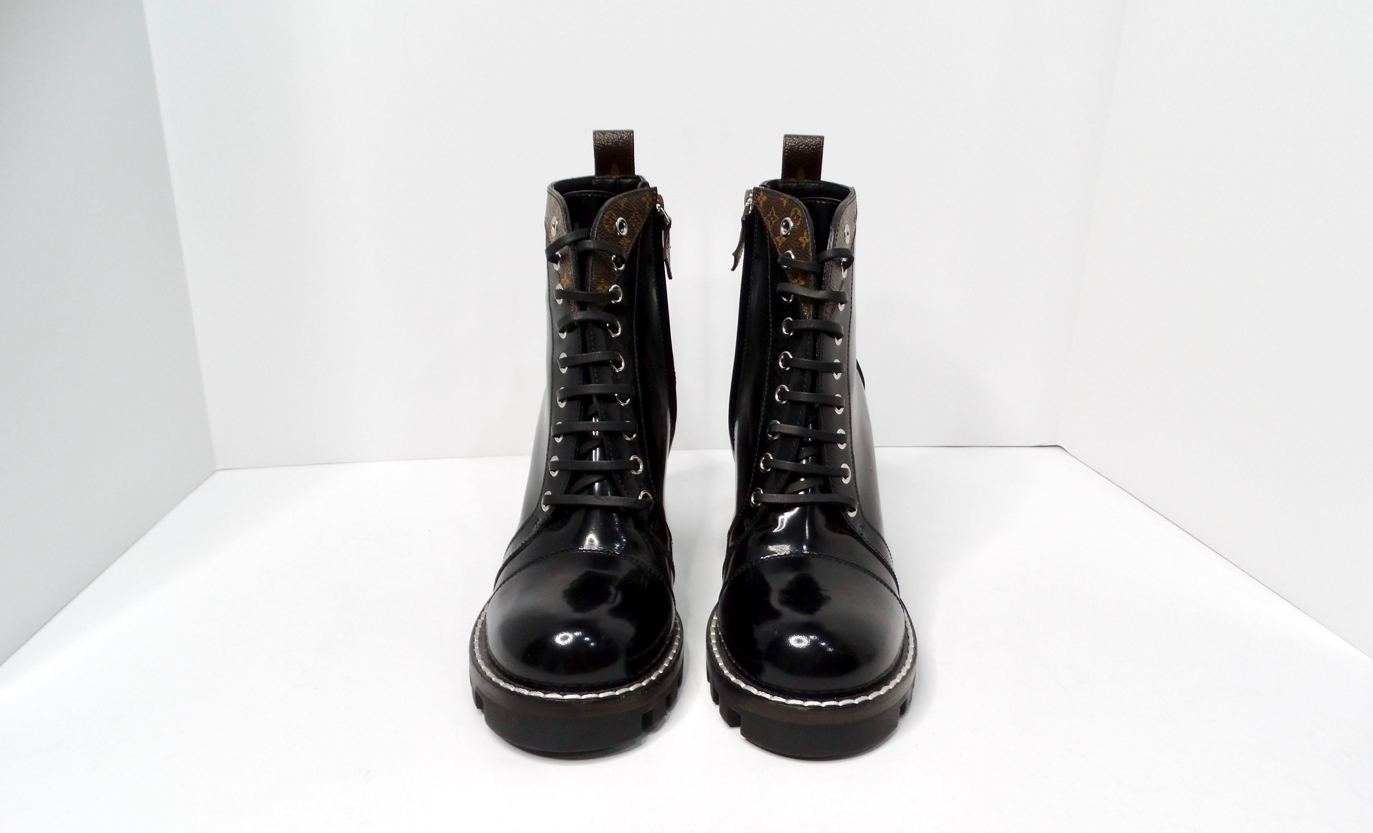 The Louis Vuitton LV Monogram Patent Leather Lace-Up Ankle Combat Boots embody a perfect blend of edgy sophistication and luxury. Crafted from high-quality black patent leather, these combat boots feature a stylish lace-up design for a snug fit and