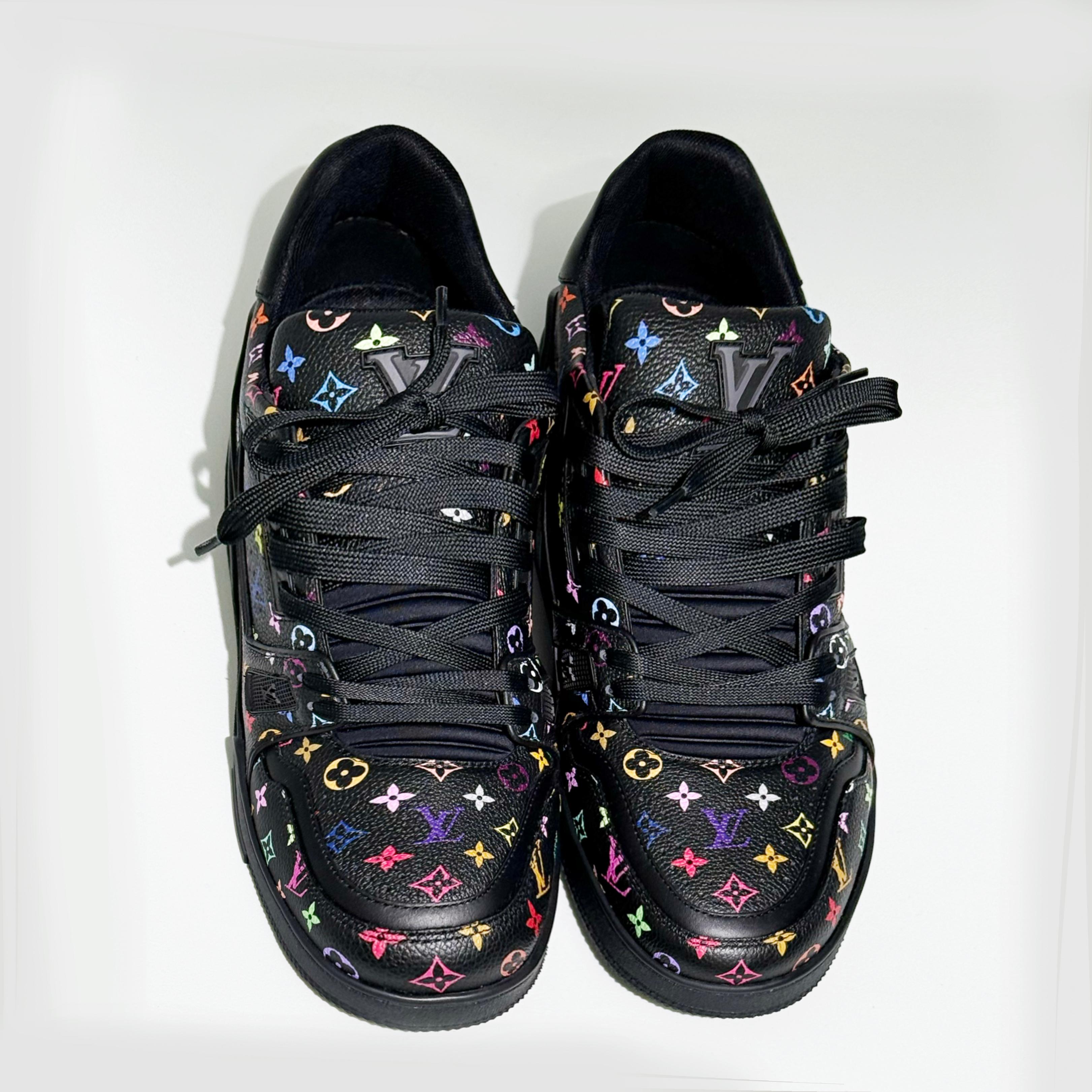 LOUIS VUITTON SNEAKER 2025 MICROCHIPPED

The iconic LV Trainer sneaker gets a bold update in grained calf leather, featuring an allover multicolored Monogram print inspired by the re-edition of the Louis Vuitton x Murakami collection. 
Blending